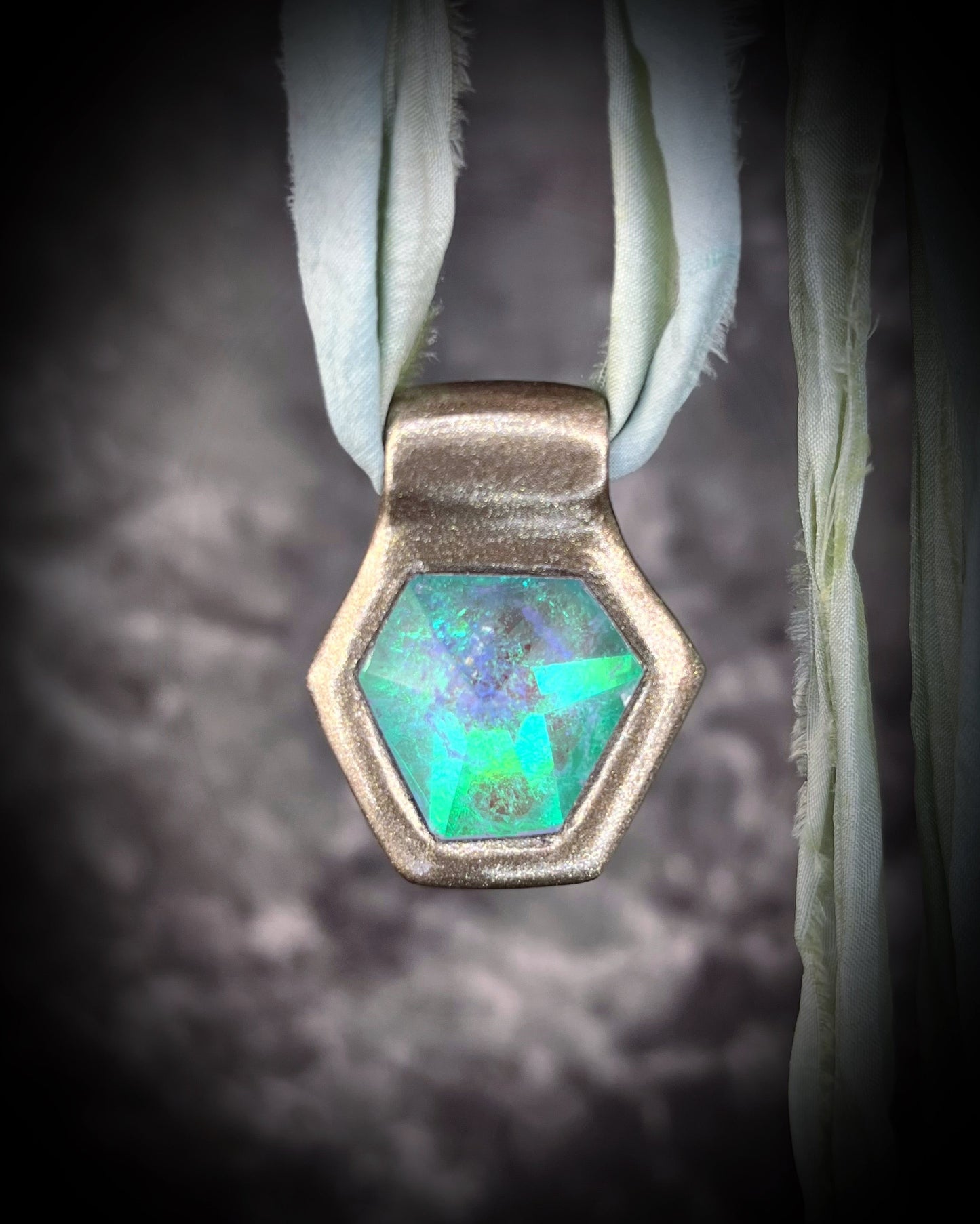 Handmade designer aqua turquoise opalescent quartz gemstone pendants in a gold finish.  crystal healing necklaces are personalized jewelry and are customizable on leather or recycled silk for the sustainable and eco-friendly jewelry lover or mermaid.