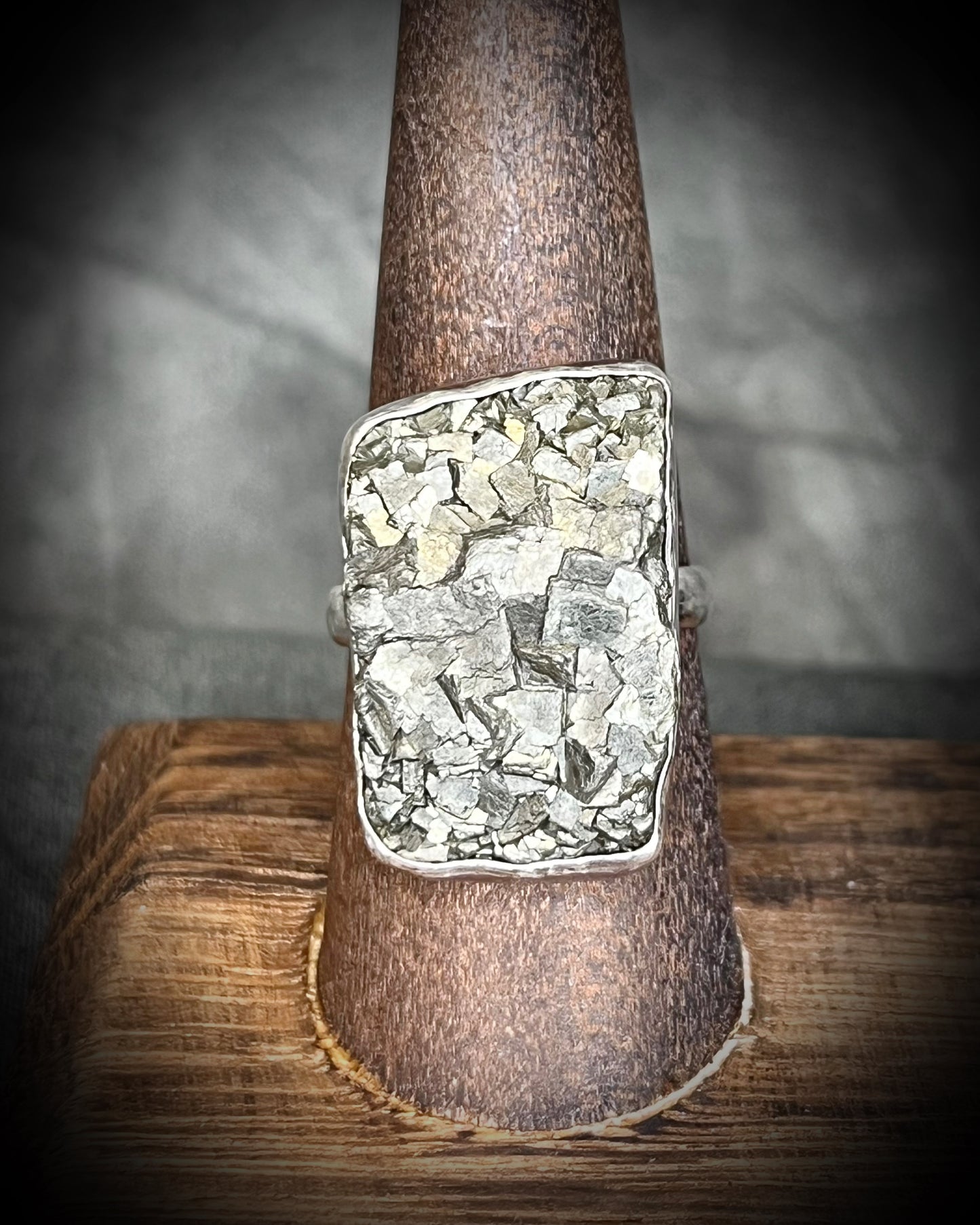 A sterling silver statement cocktail ring featuring a dazzling pyrite crystal.  Manifest your dreams and protect your energy with style.