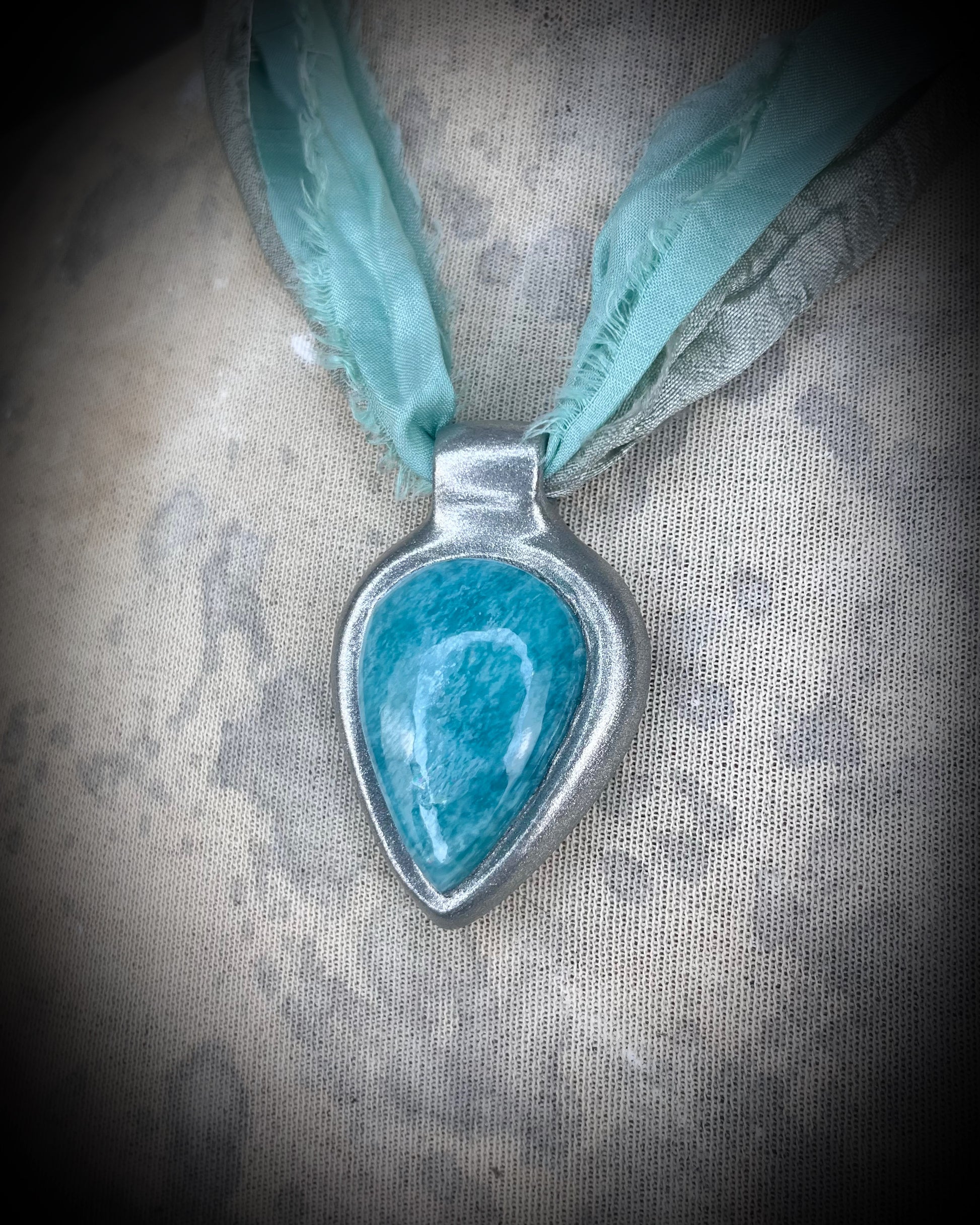 Amazonite handmade crystal healing gift for calm and balance.  Silver teardrop gemstone necklace hung from recycled silk for summer, festival, travel, pregnancy jewelry or boho everyday magic.
