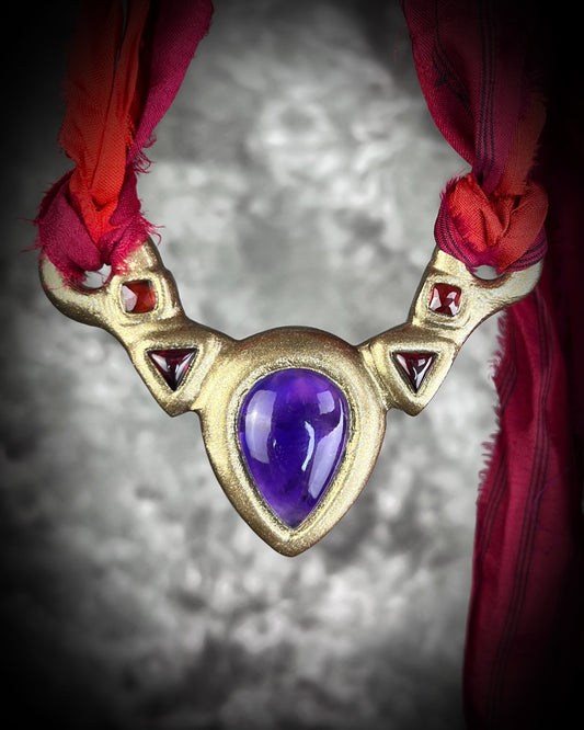 Amethyst and Garnet Birthstone Crystal Healing Collar Talisman – A regal gift for 2026 that enhances inner peace, psychic channels, and protection. Handcrafted in the USA and hung from red recycled silk for the sustainable Queen.