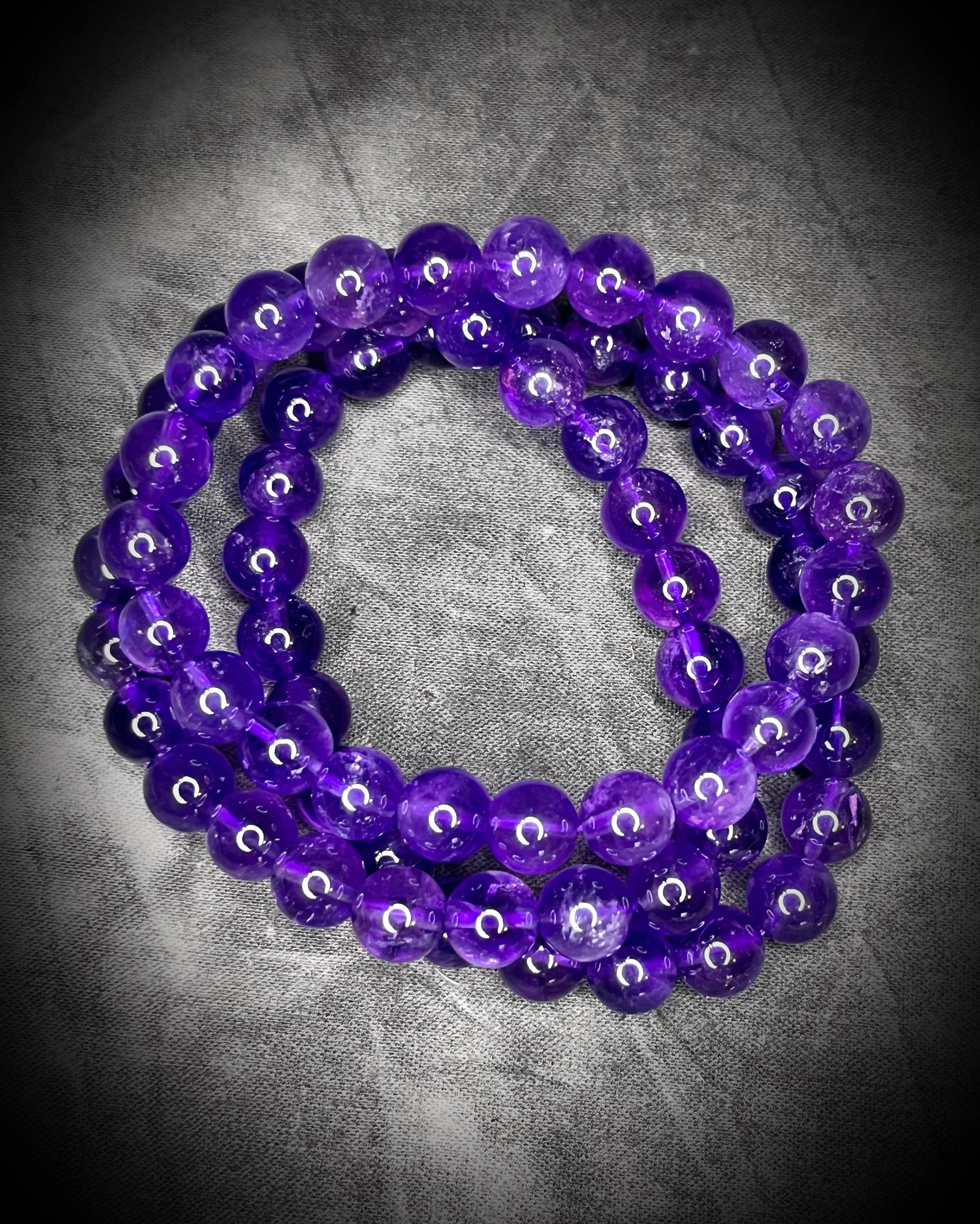 Amethyst crystal healing beaded bracelets for protection, grounding, emf shielding and gemstone magic!  Crystal stacking bracelets for holiday gifting and new year resolution setting.