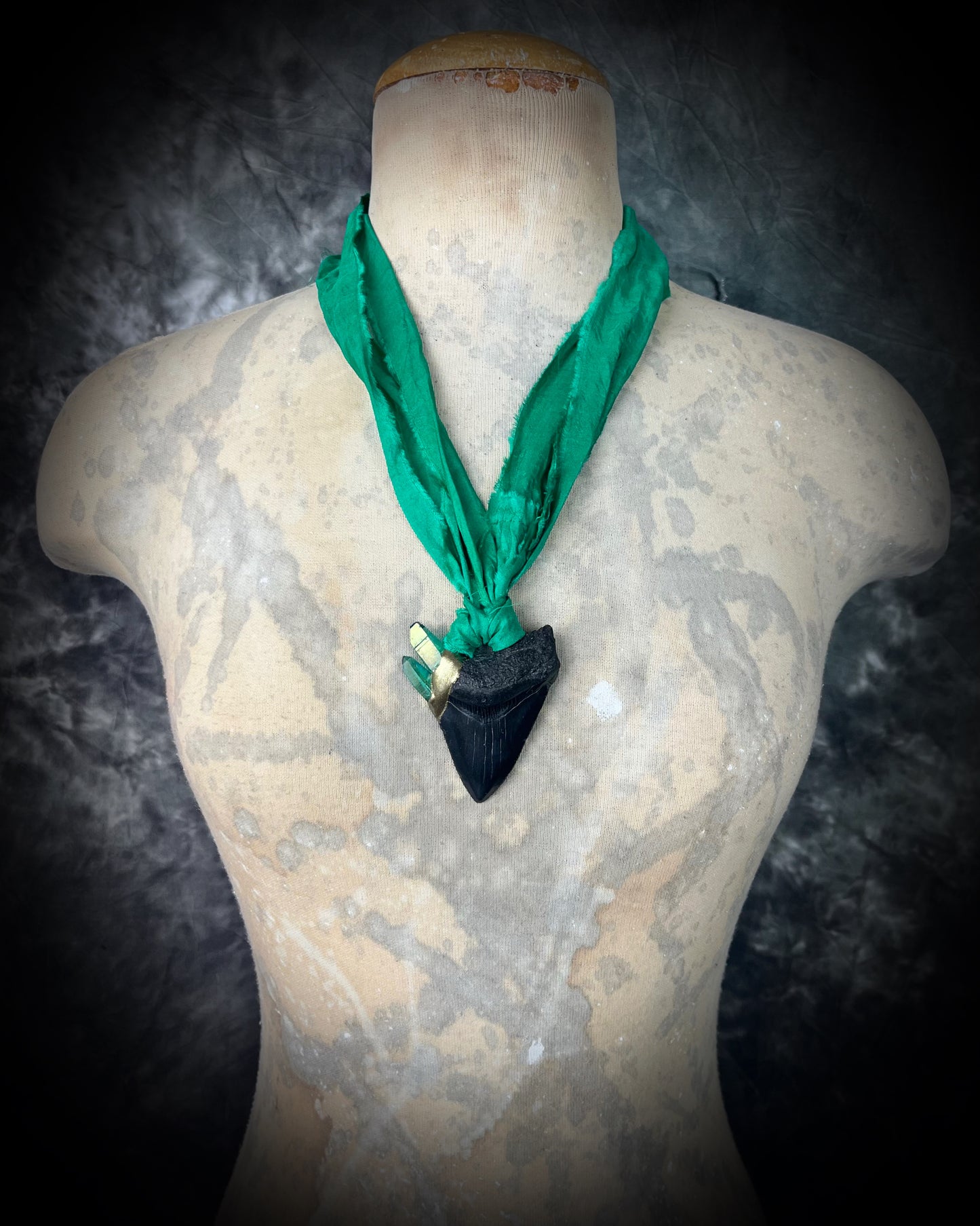 Ancient megalodon fossil tooth necklace with green aura quartz points. Gemstone fantasy jewelry for the wild-hearted and fearless. Green recycled silk jewelry gift for her holiday 2025.
