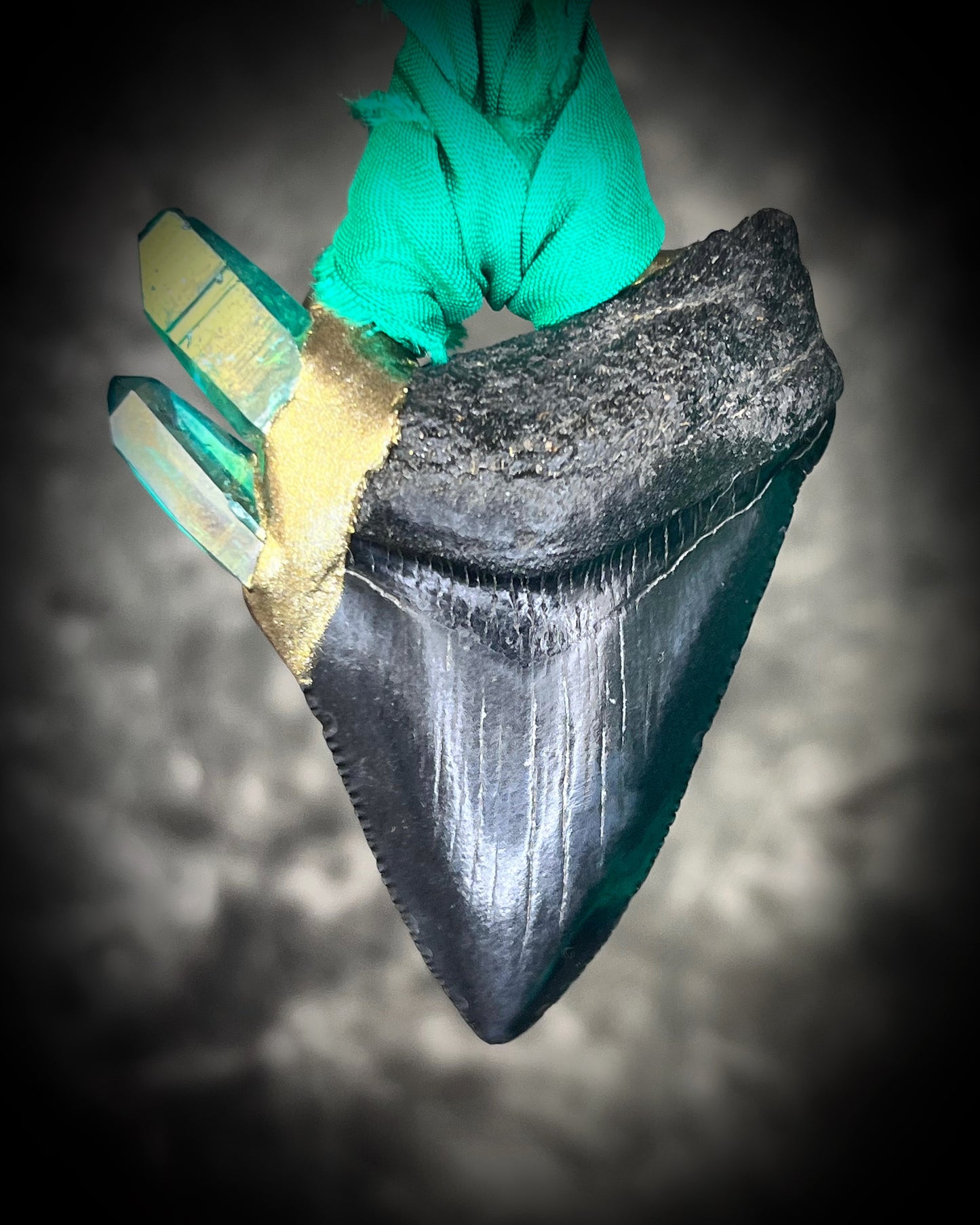 Ancient megalodon fossil tooth necklace with green aura quartz points, hung from sustainable green recycled silk. Gemstone fantasy jewelry for the wild-hearted and fearless. Handmade jewelry gift for her holiday 2025.