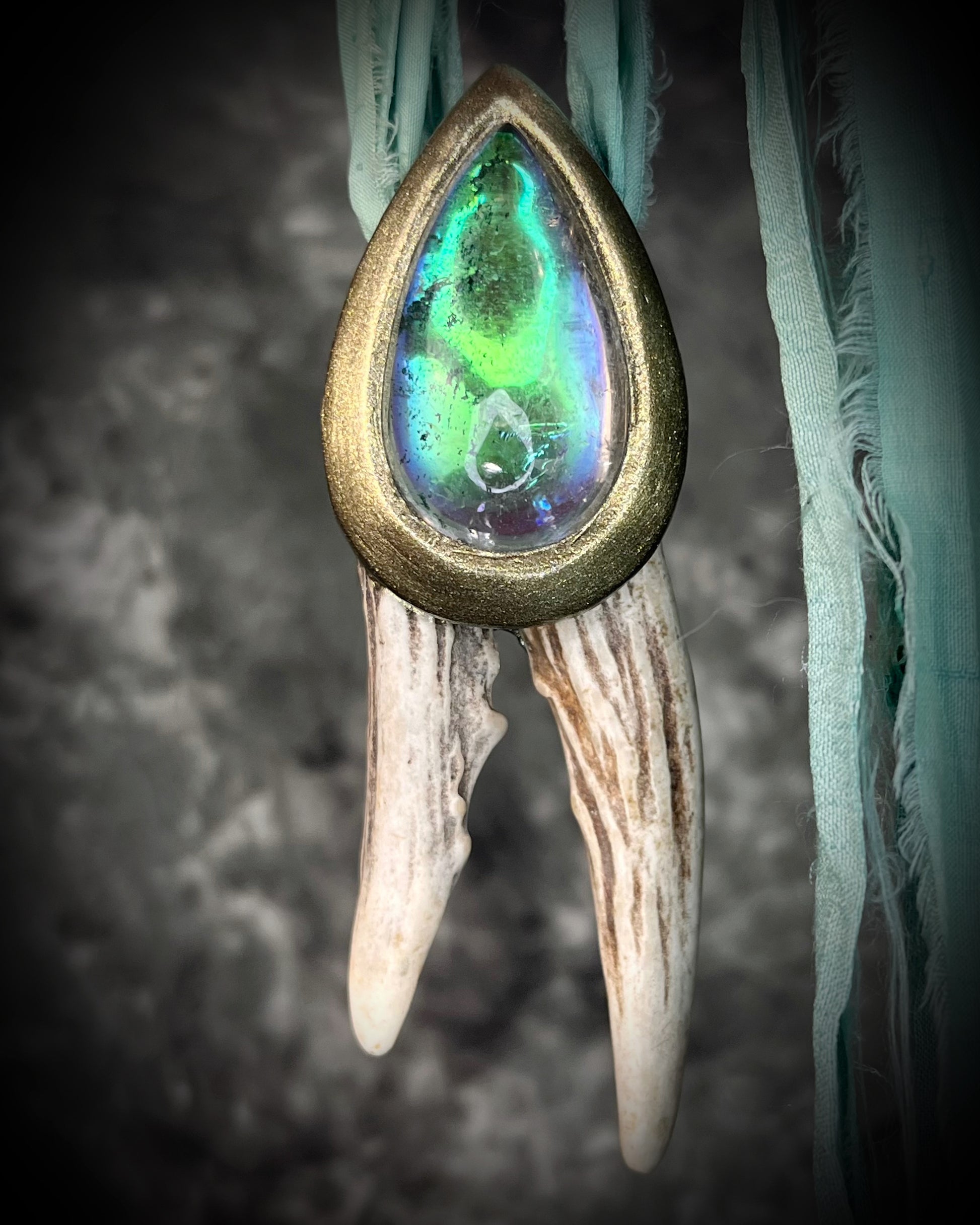 Artemis Goddess handmade Necklace with green crystal quartz teardrop framed in a gold setting and two naturally shed deer antlers, hung from mint green recycled silk. Nature inspired jewelry gift for her. 