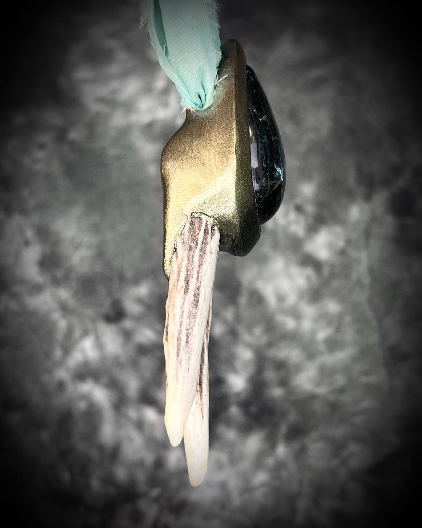 Artemis Goddess handmade Necklace with green crystal quartz teardrop framed in a gold setting and two naturally shed deer antlers, hung from mint green recycled silk. Nature inspired jewelry gift for her. 