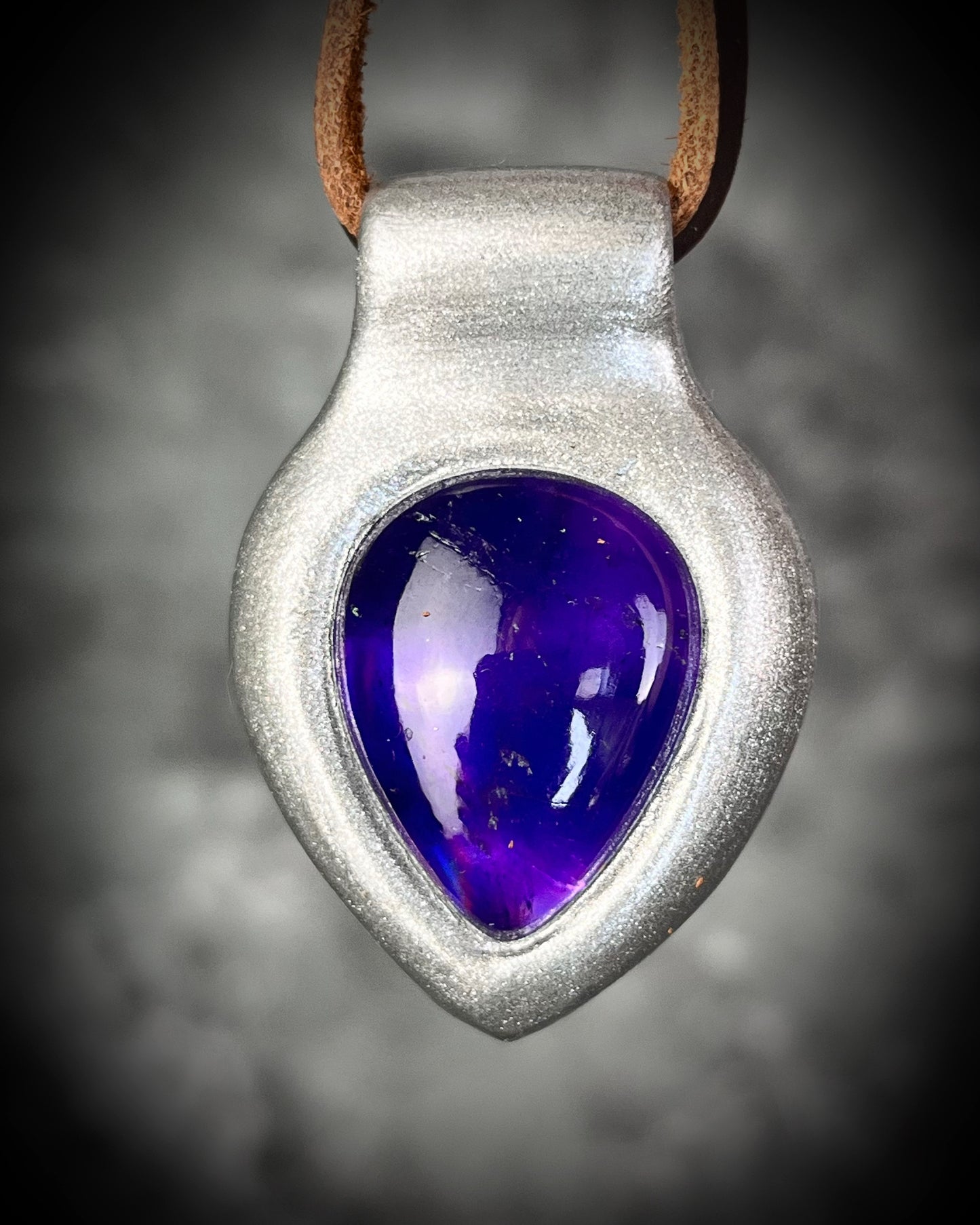 Enchanting amethyst crystal teardrop silver pendant hung from soft organic brown leather. Mystical and spiritual handmade gift jewelry for her. Birthstone jewelry for her. Aquarius gift necklace. 
