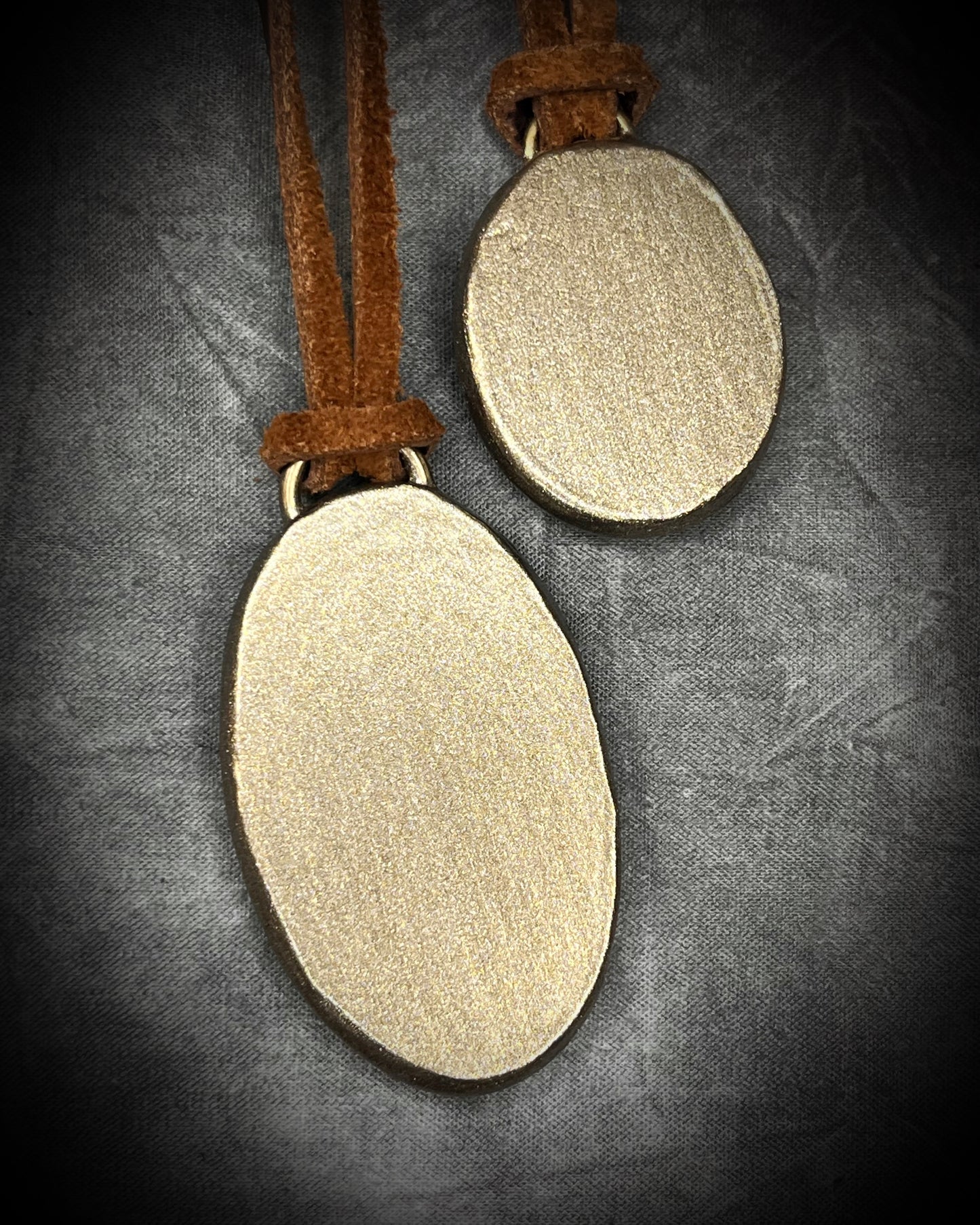 Year of the Horse inspired necklaces featuring Wild Horse Magnesite crystal, both in a gold setting and hung from earthy brown leather. Talismans for wild hearts and boho western fashion. 