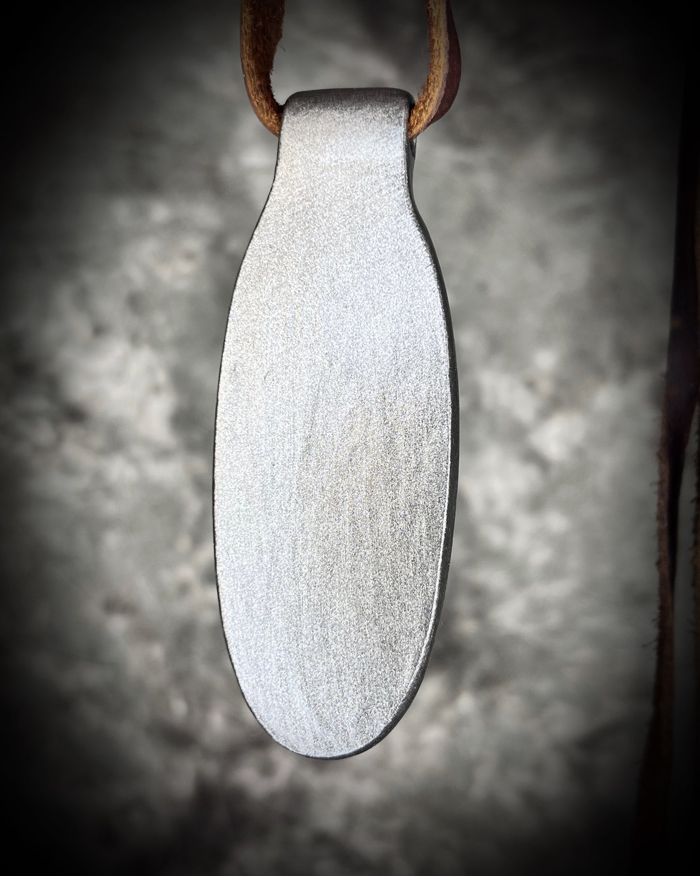 Back view of Shimmering moss kyanite crystal healing talisman in dark silver finish hung from soft and rugged brown leather. Gift intuition, transformation and communication.