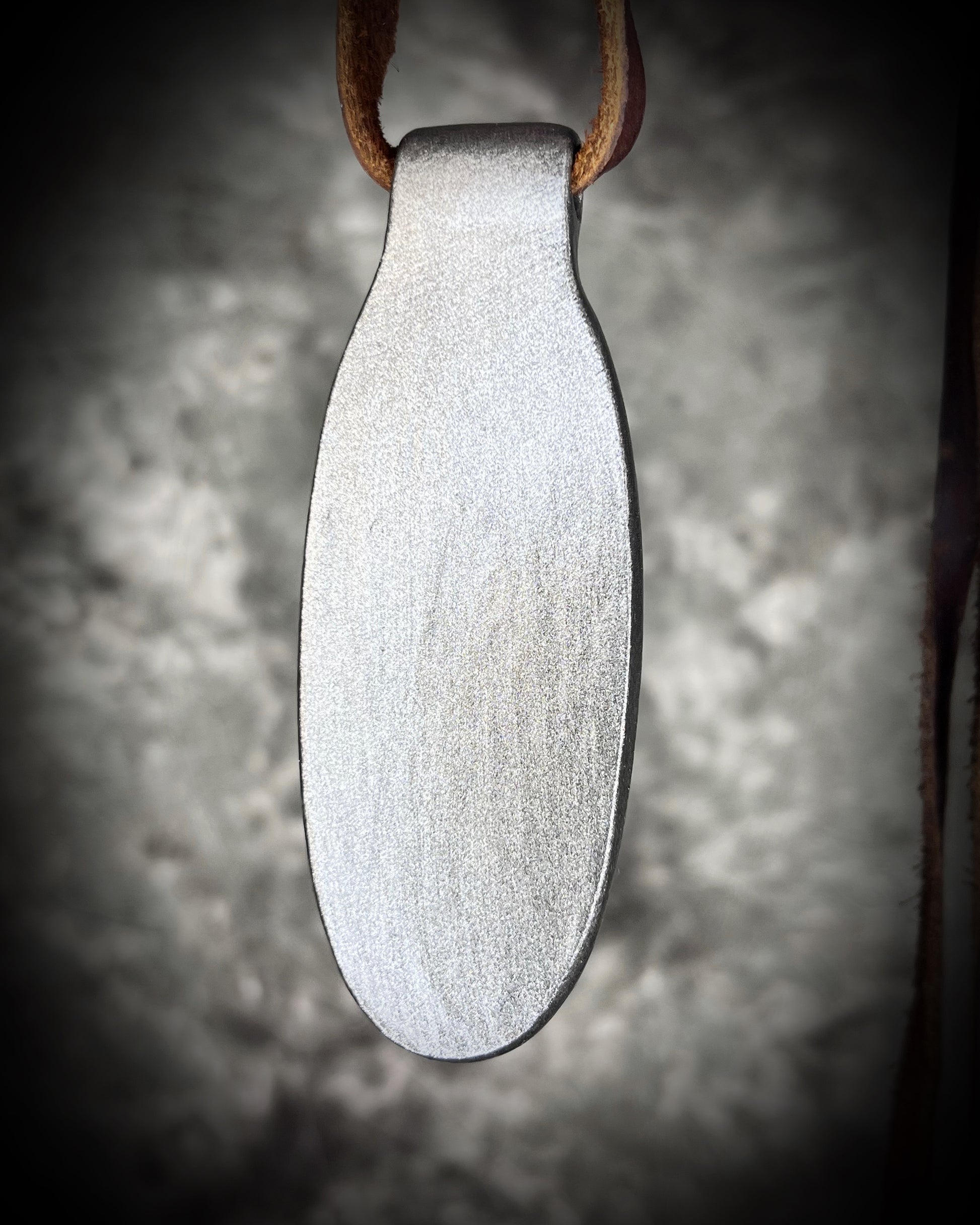 Back view of Shimmering moss kyanite crystal healing talisman in dark silver finish hung from soft and rugged brown leather. Gift intuition, transformation and communication.