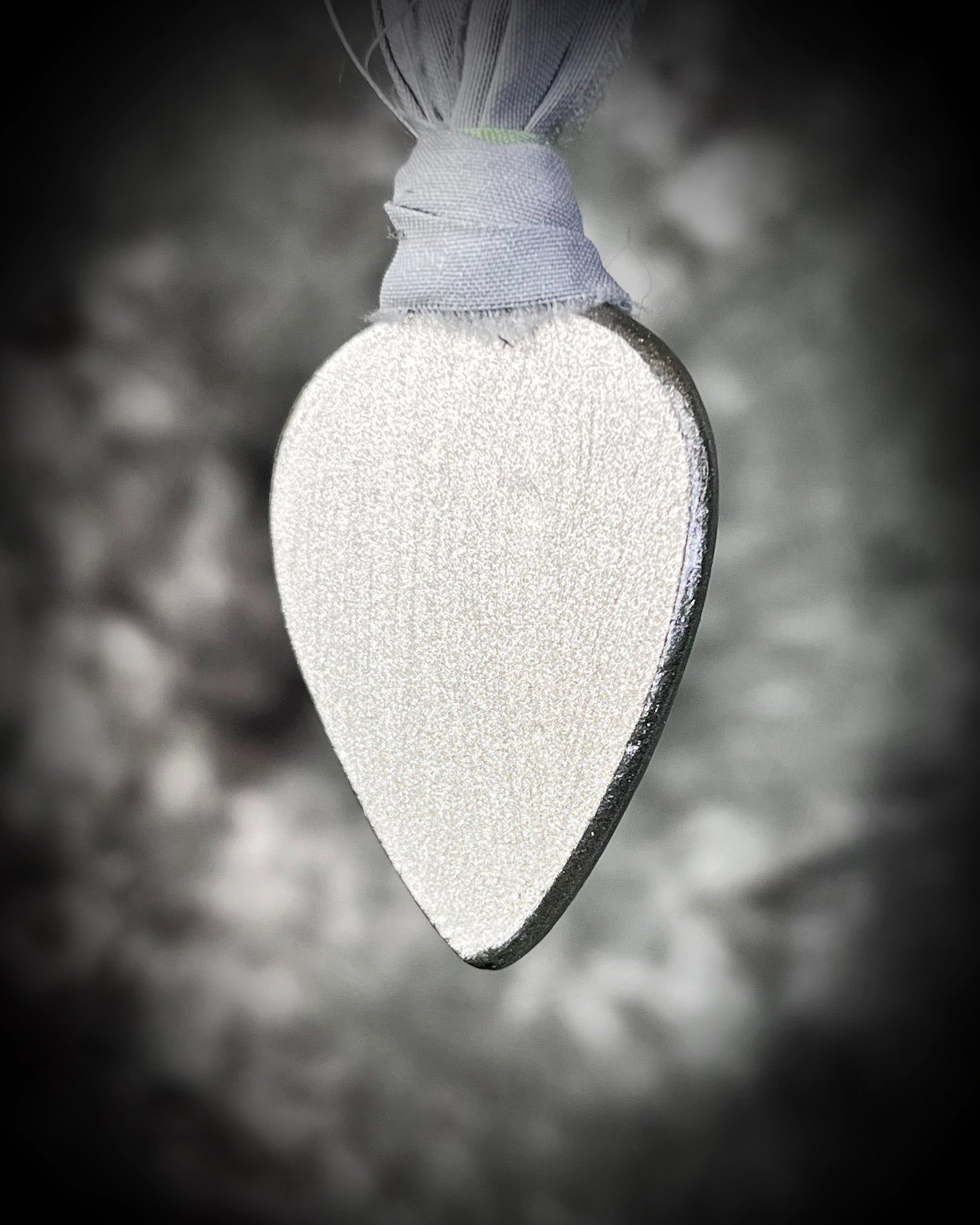 Back view of teardrop-shaped green chrysoprase gemstone necklace on grey and aqua recycled silks. Best spiritual gift for her fall 2025. Bohemian crystal healing handmade jewelry.