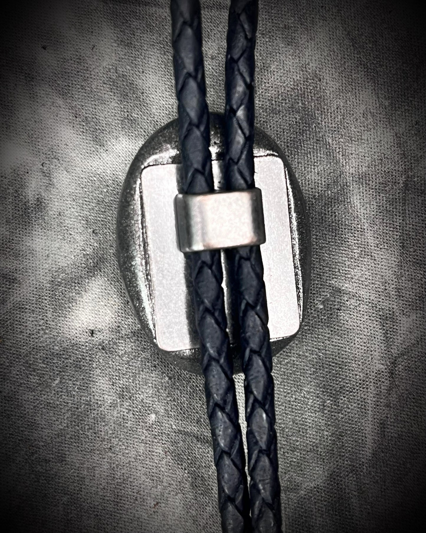 Blue kyanite handmade bolo tie for him or her, gunmetal silver finish on black leather.