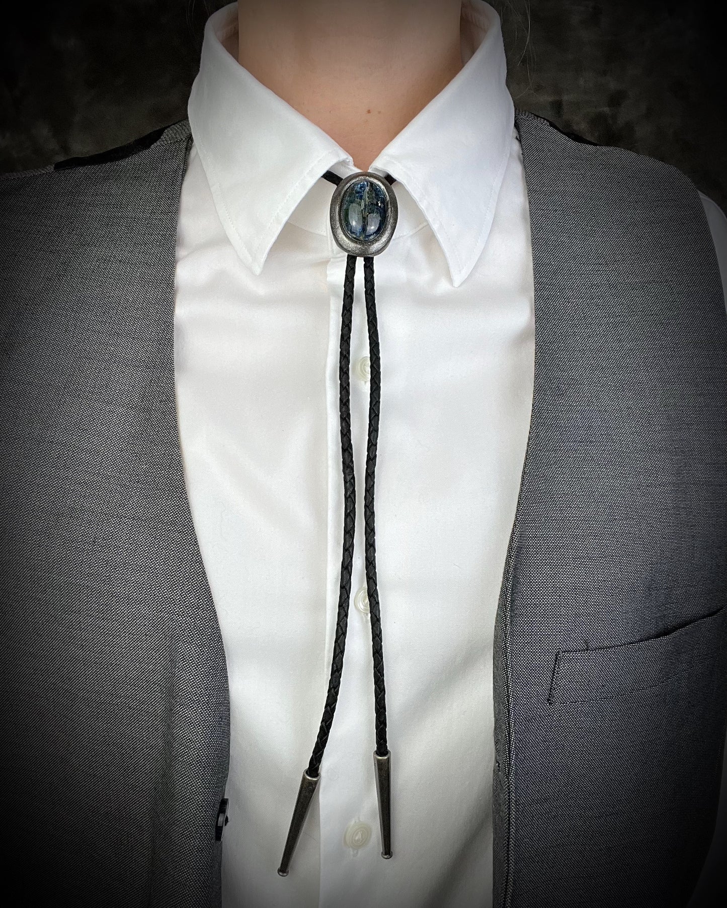 Blue kyanite handmade bolo tie for him or her, gunmetal silver finish on black leather. 