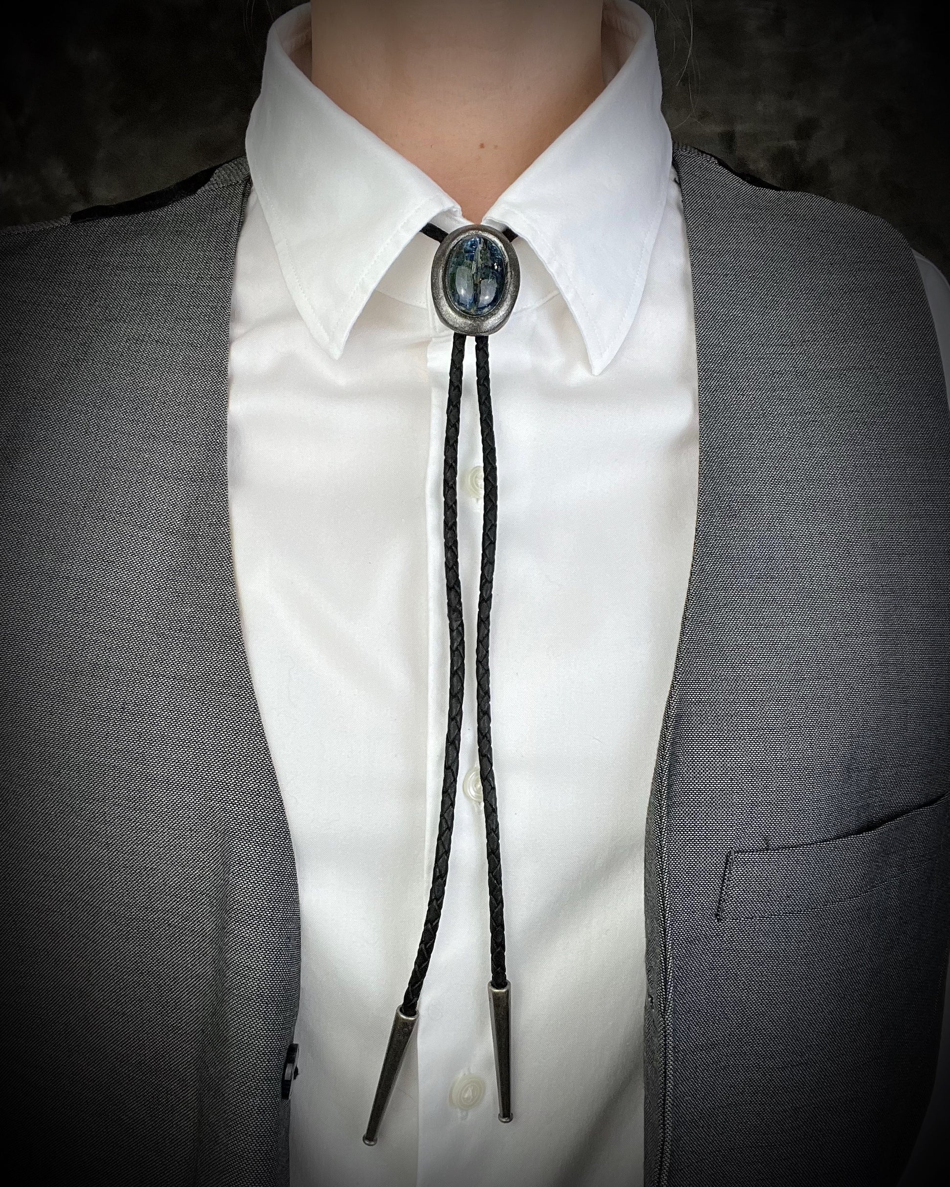 Blue kyanite handmade bolo tie for him or her, gunmetal silver finish on black leather. 