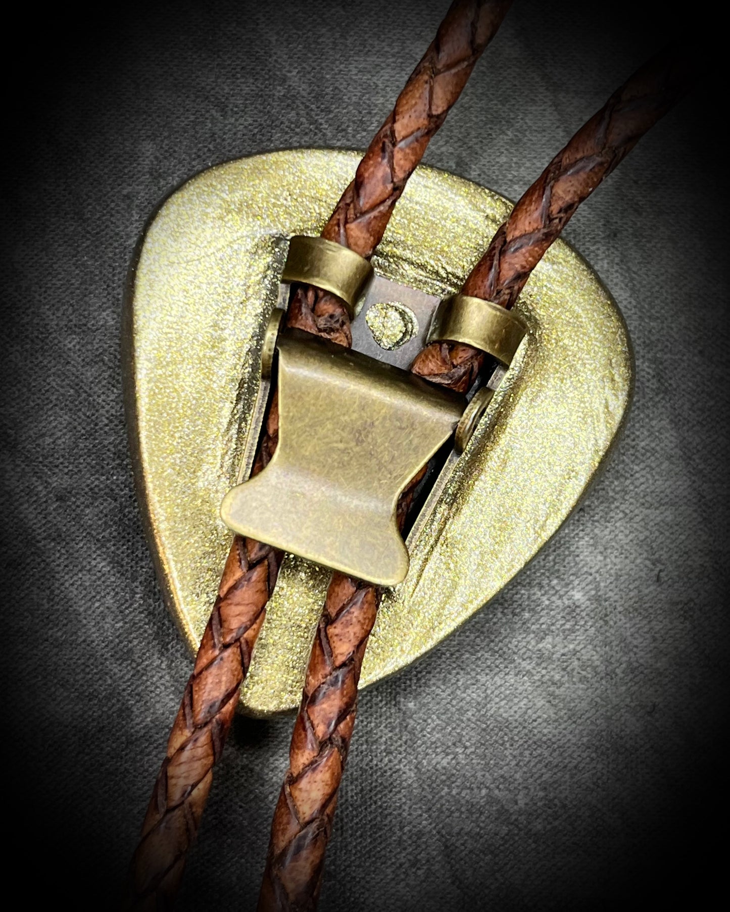 Bolo tie back details showing clasp and braided brown leather