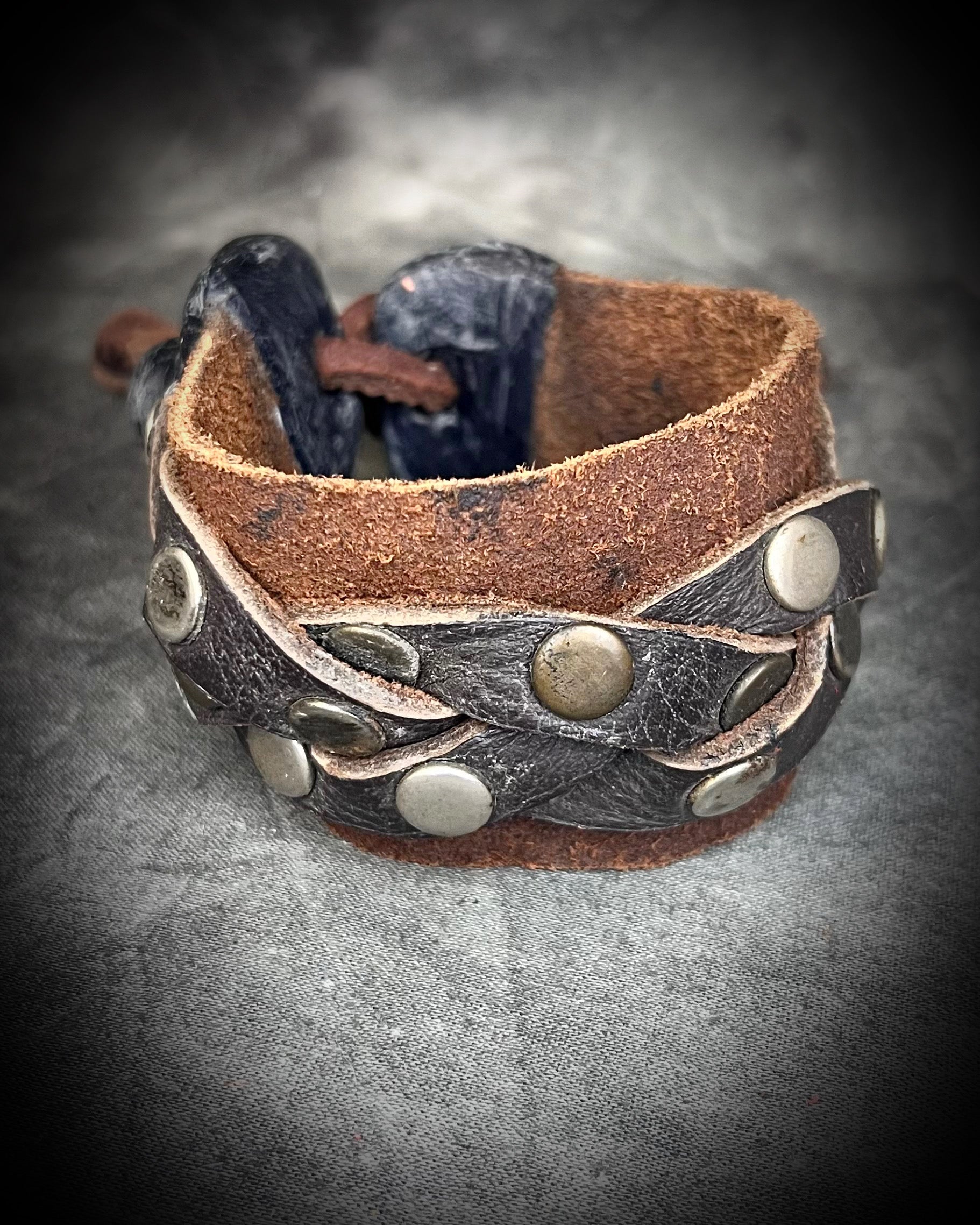 Brown braided leather bracelet with metal studs and carnelian crystal accents. Unisex crystal healing cuff jewelry gift for him or her. 