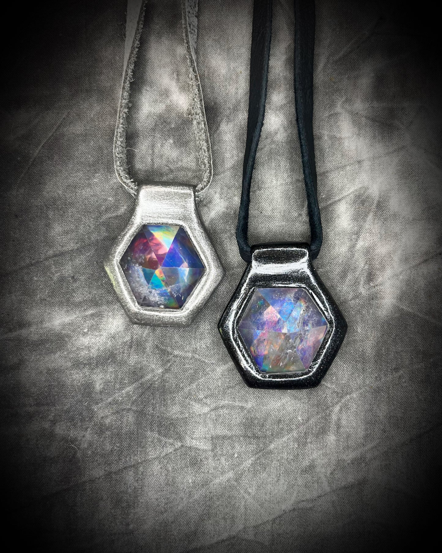 Silver and Black David Bowie inspired handmade designer quartz crystal black rainbow necklaces. Black finish on black leather, gunmetal finish on silver leather. 