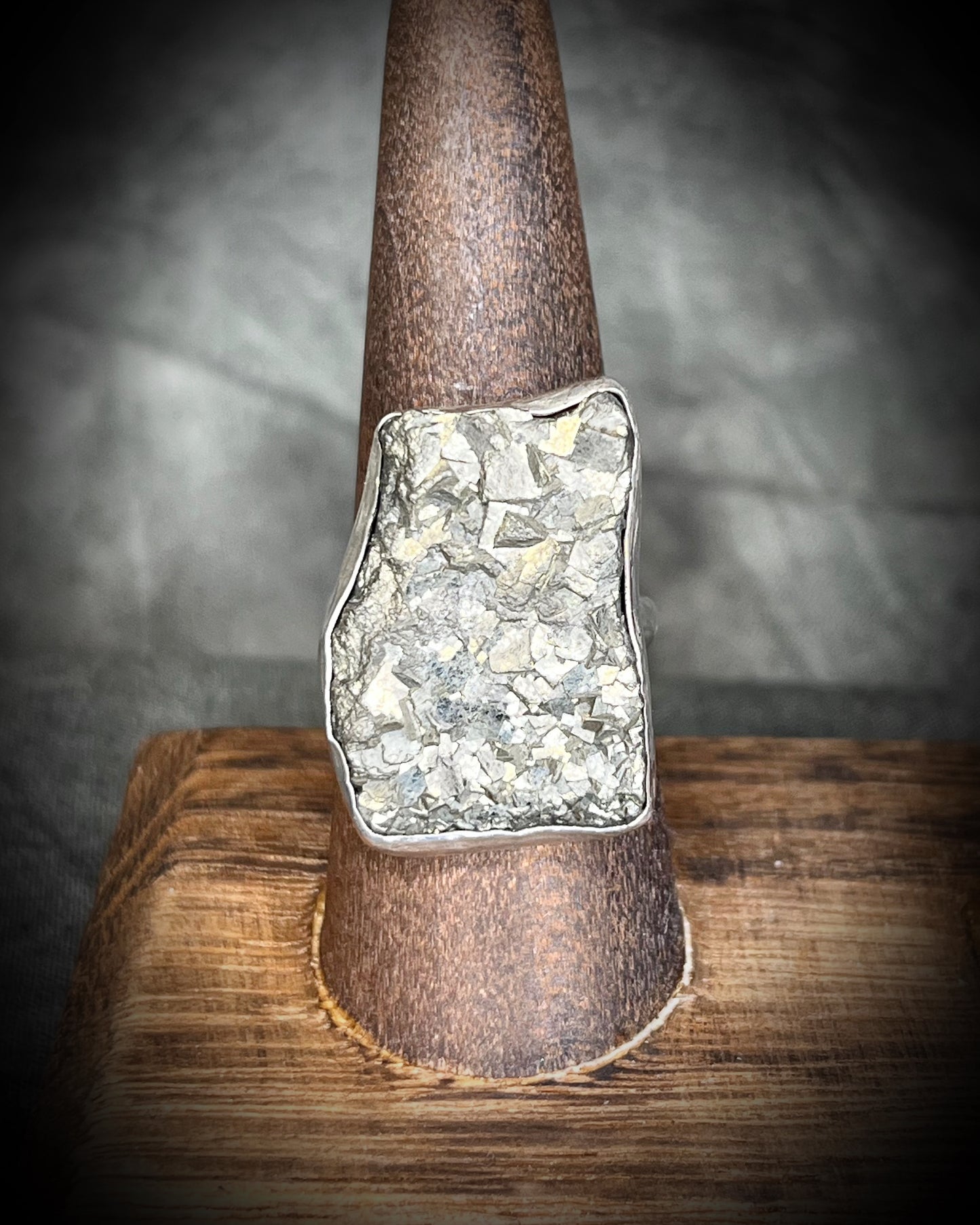 A sterling silver statement cocktail ring featuring a dazzling pyrite crystal.  Manifest your dreams and protect your energy with style.