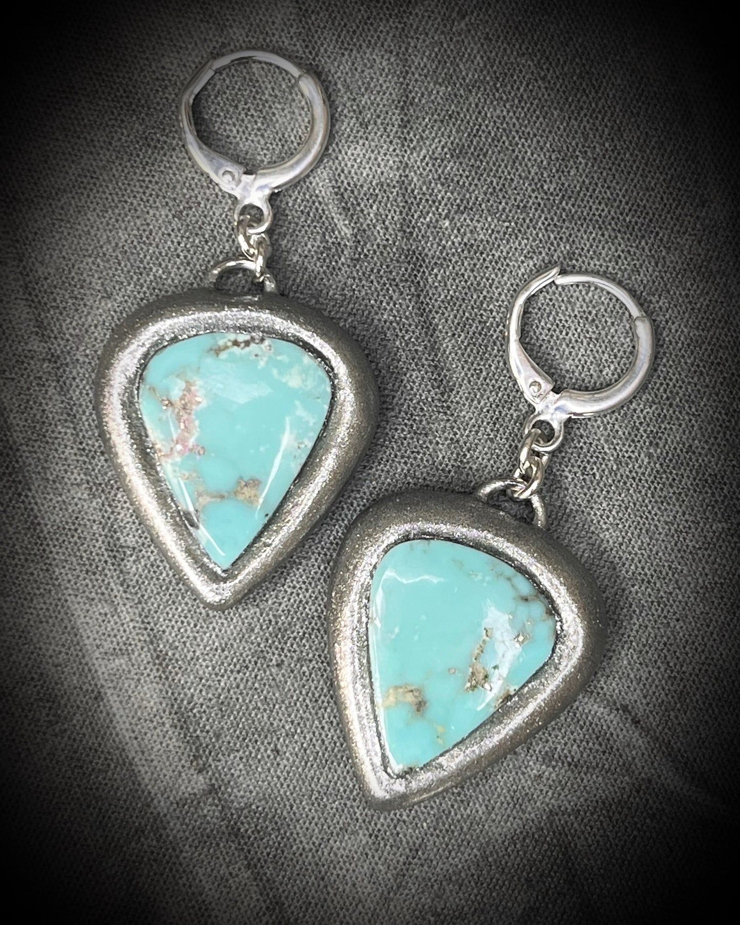 Campitos Turquoise teardrop shaped earrings with silver frames and sterling plated huggie hooks. Handmade crystal healing jewelry for her. 