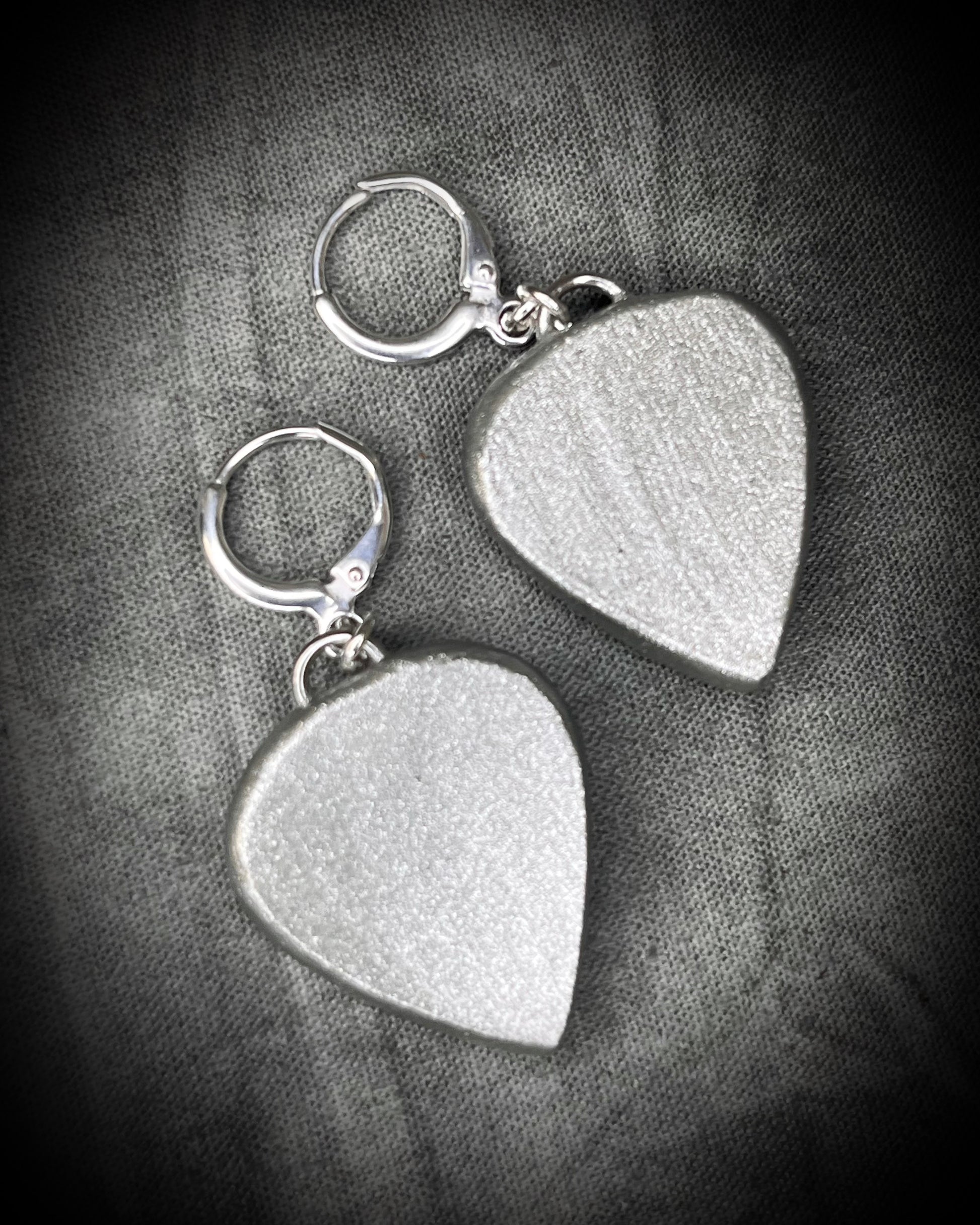 Campitos Turquoise teardrop shaped earrings with silver frames and sterling plated huggie hooks. Handmade crystal healing jewelry for her. 