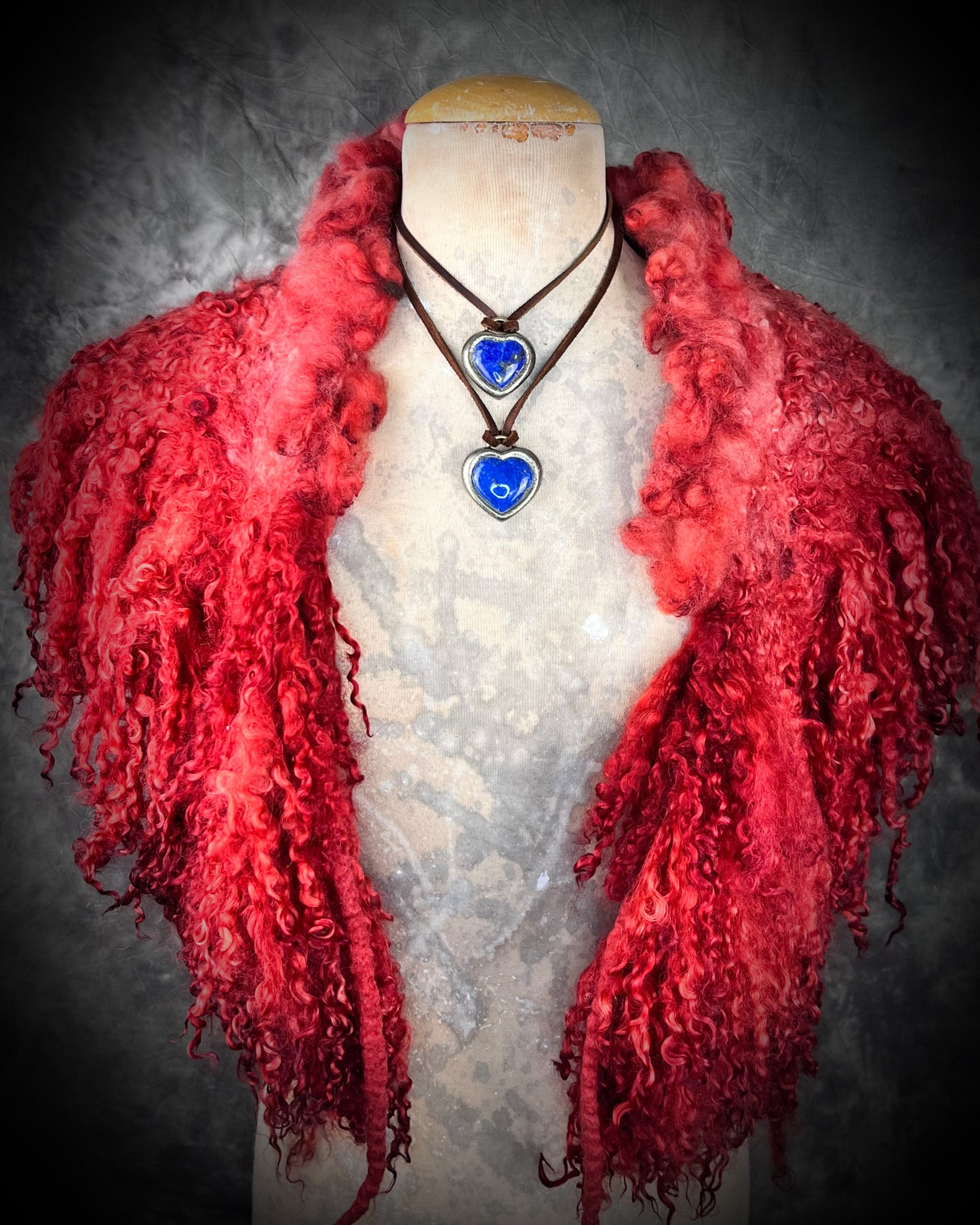 Model bust wearing Celestial blue lapis lazuli necklace displayed on natural fabric, handmade bohemian crystal jewelry.