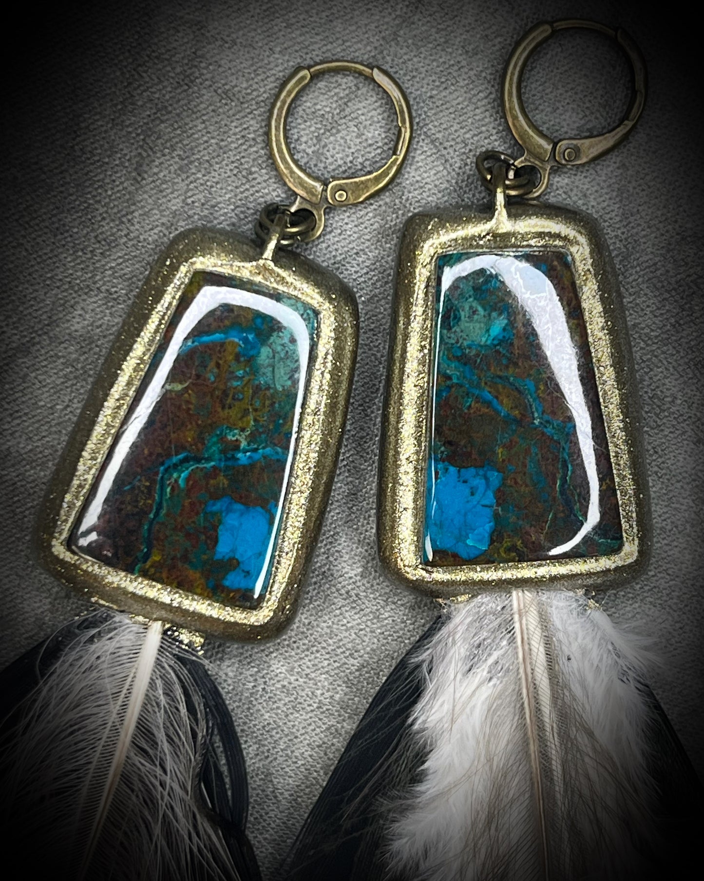 Chrysocolla and feather earrings with blue-green natural stone, gold finish, and hypoallergenic brass huggie hooks, handmade by Become Spellbound.