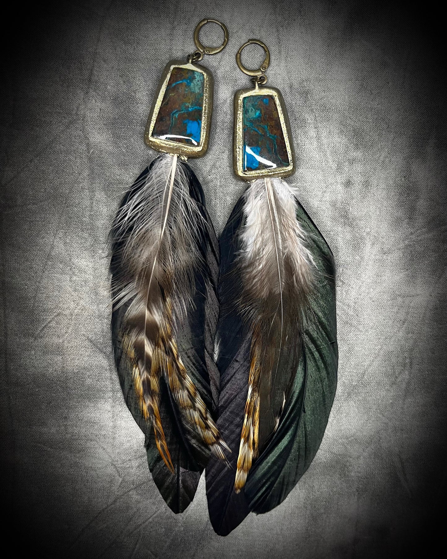 Chrysocolla and feather earrings with blue-green natural stone, gold finish, and hypoallergenic brass huggie hooks, handmade by Become Spellbound.