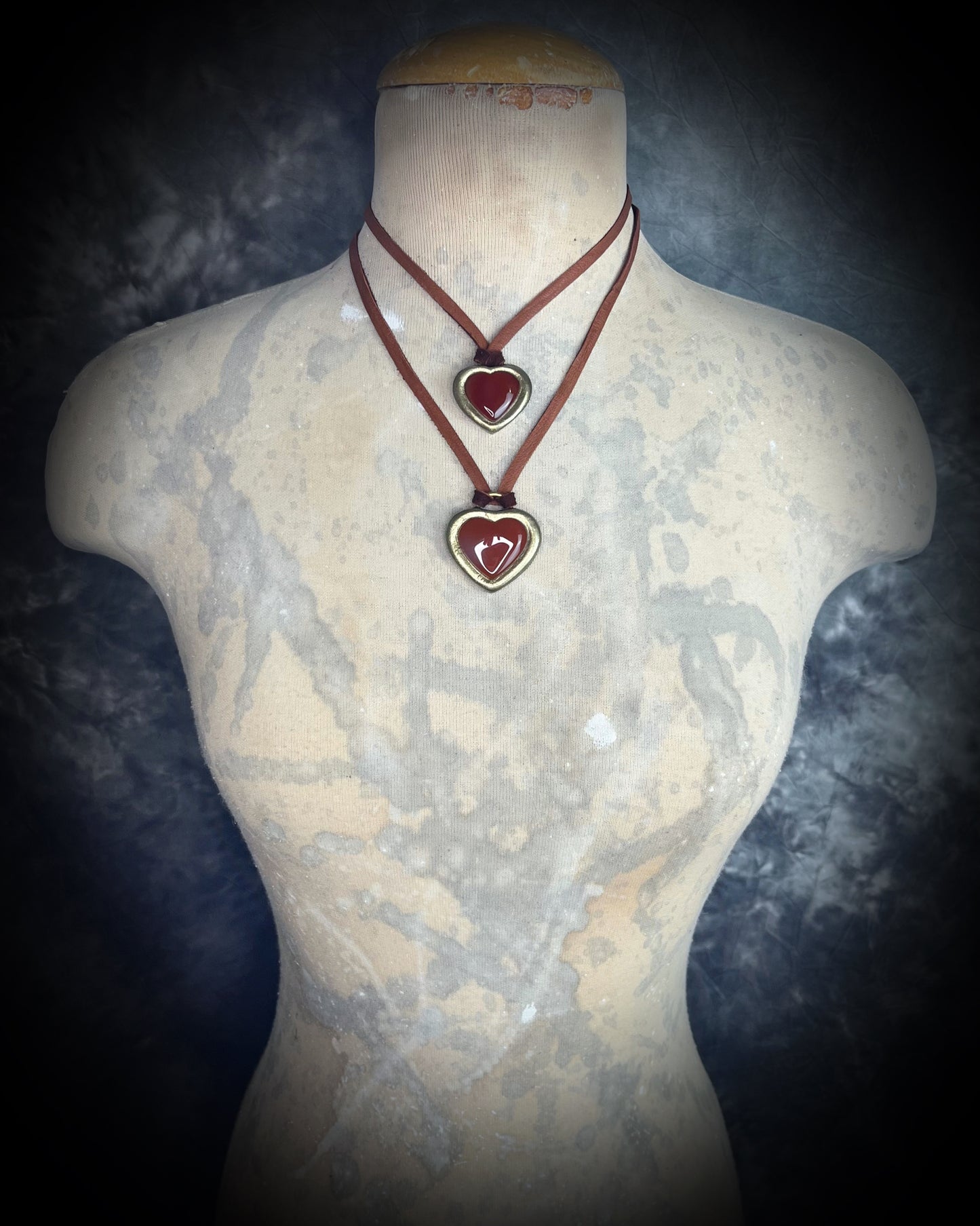 Chunky Carnelian crystal heart necklace on earthy brown leather, handmade gemstone talisman for courage, creativity, and seasonal fall fashion.