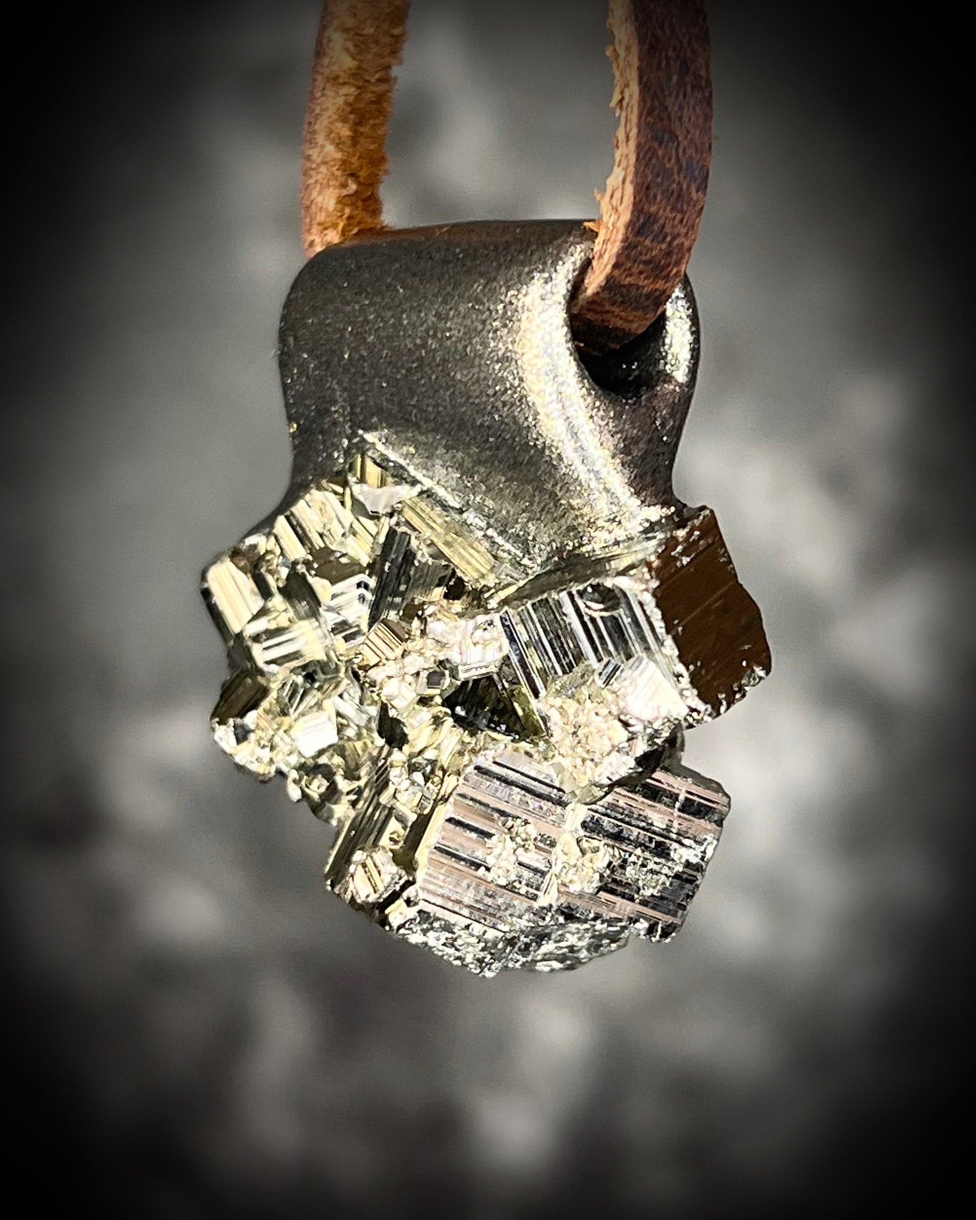 Chunky Pyrite crystal necklace handmade and hung from brown leather. Sculpttural raw gemstone jewelry for her. Manifestation pendant, wearable magic. 