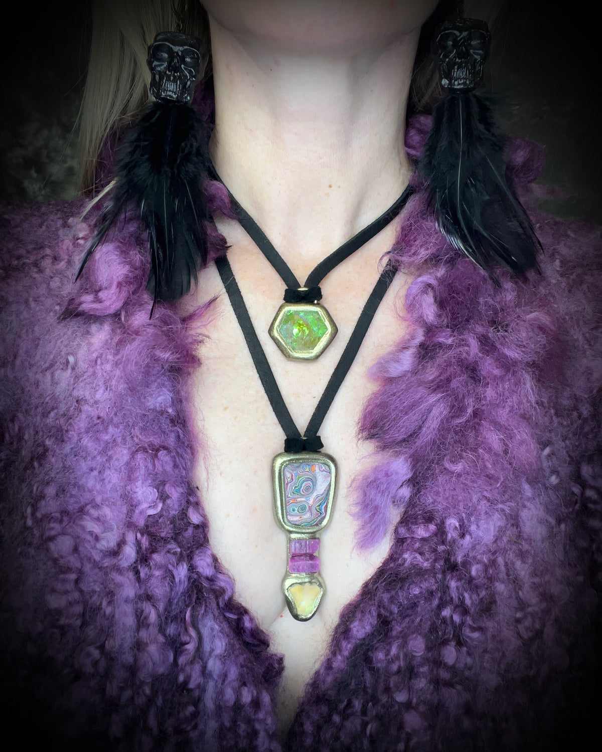 Citrine quartz pyramid crystal with a mystical green glow in a sculptural gold-finish talisman setting on black leather, handmade by Become Spellbound in Baltimore, Maryland.