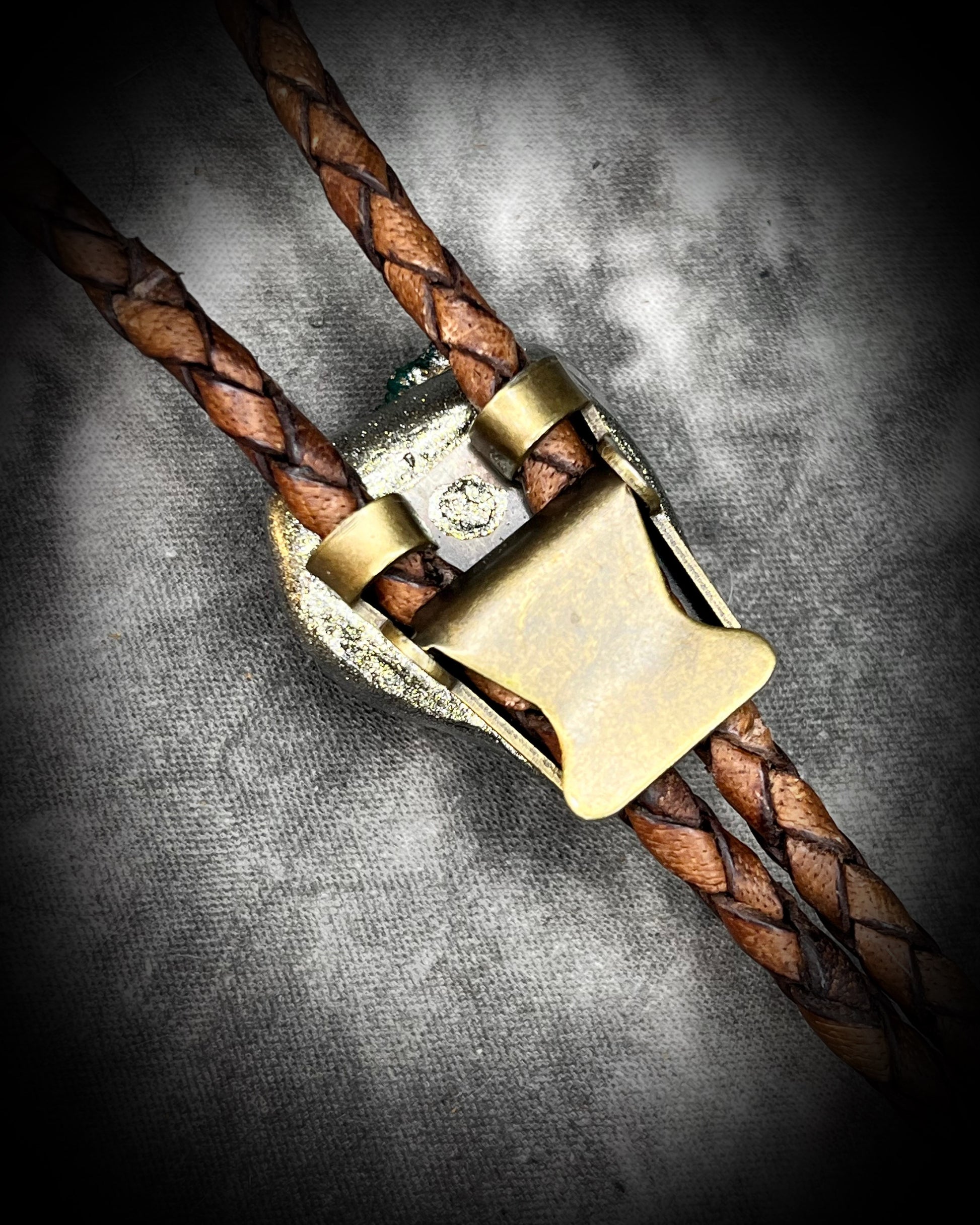 Clasp and back view of Chunky Pyrite and Dioptase crystal bolo tie on brown leather – unique handmade bolo necklace, artisan gemstone bolo tie jewelry, mystical men’s bolo for bold style.