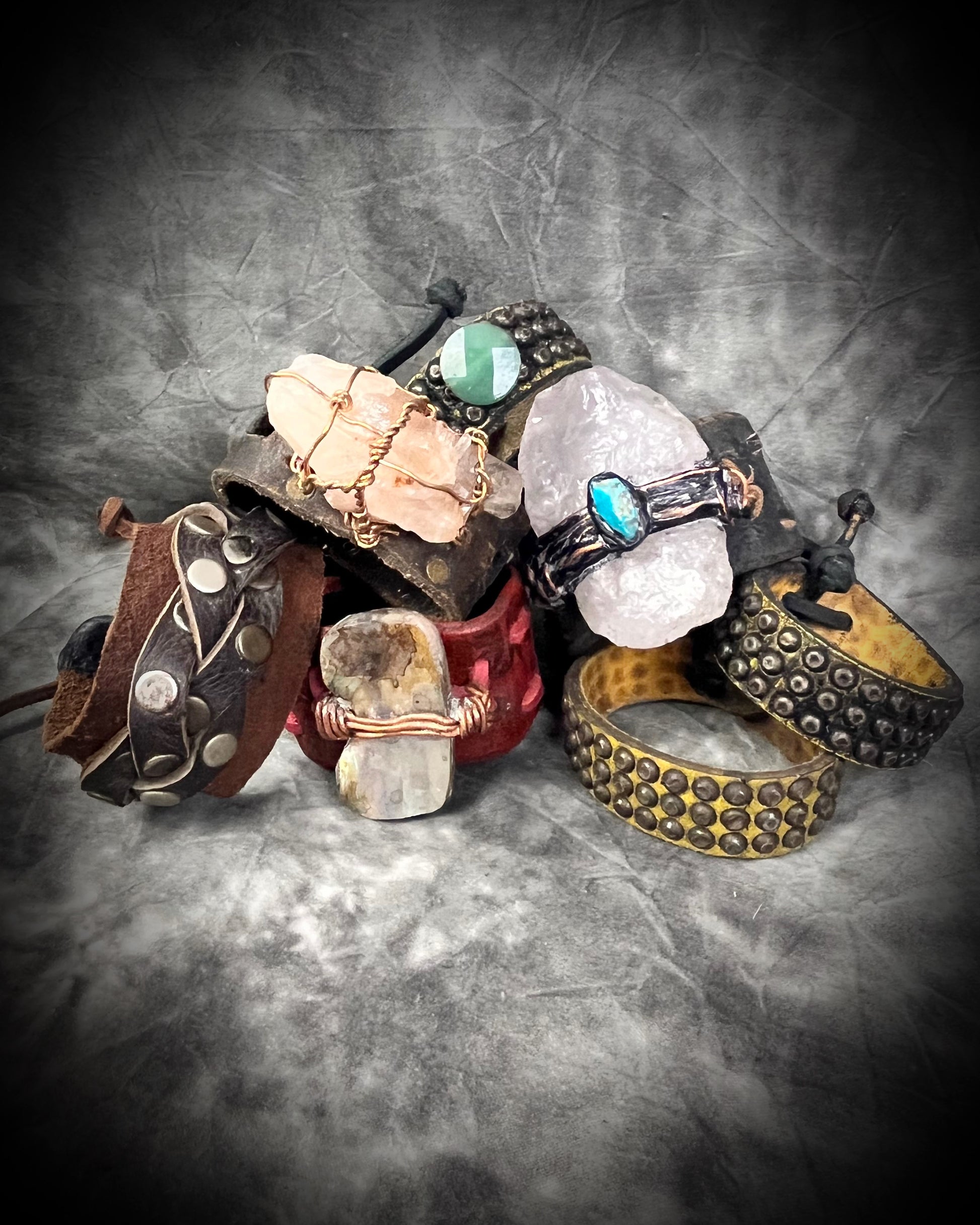 Collection of various handmade leather and gemstone bracelets with stones and leather, cool rugged gift for her or him.