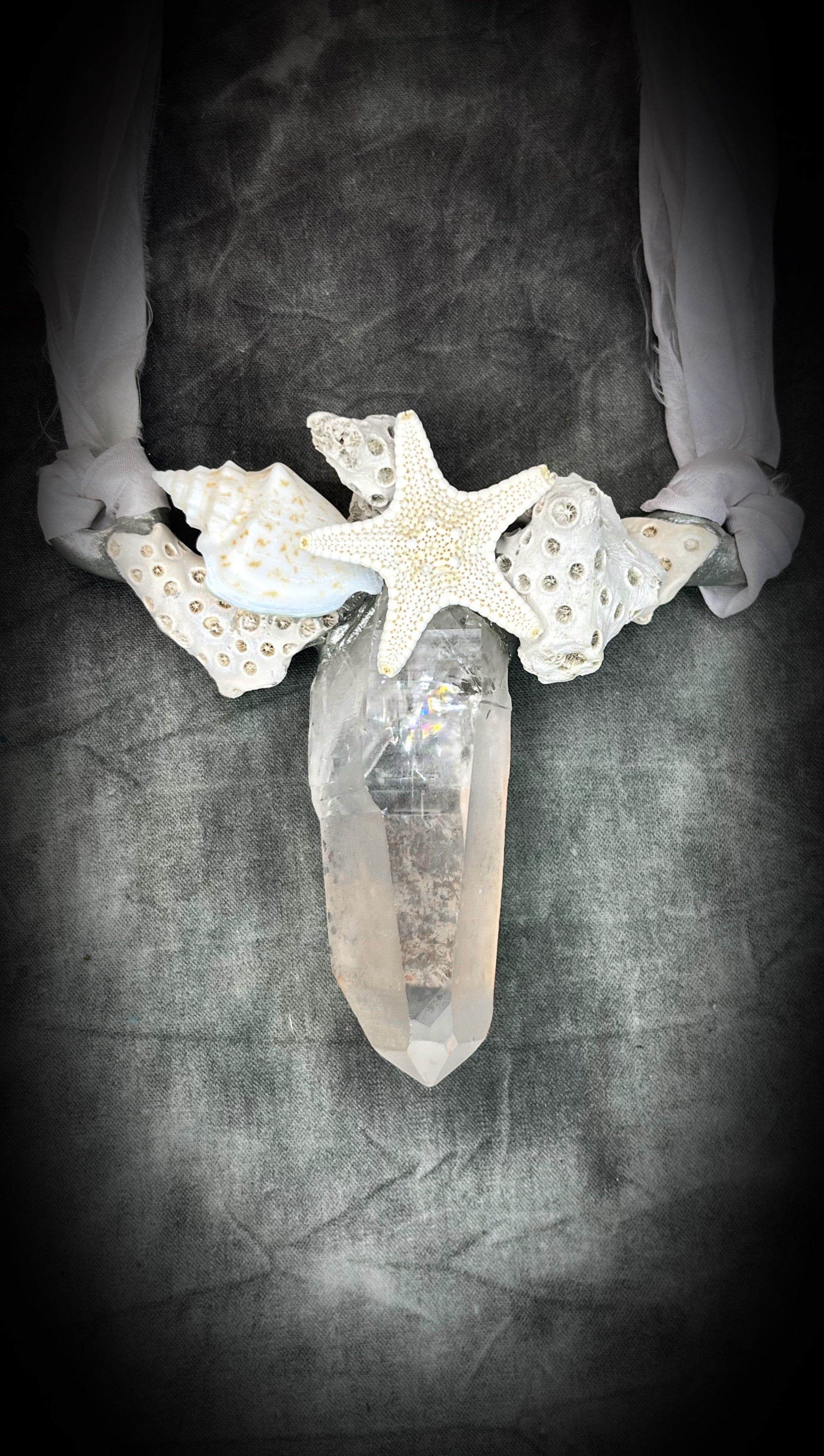 See the rainbows in the gemstone, 
handmade designer bridal or beach bride necklace featuring quartz crystal, white fossilized coral, starfish, seashell and is strung from recycled white silk for an eco-friendly summer beach wedding elegance.  