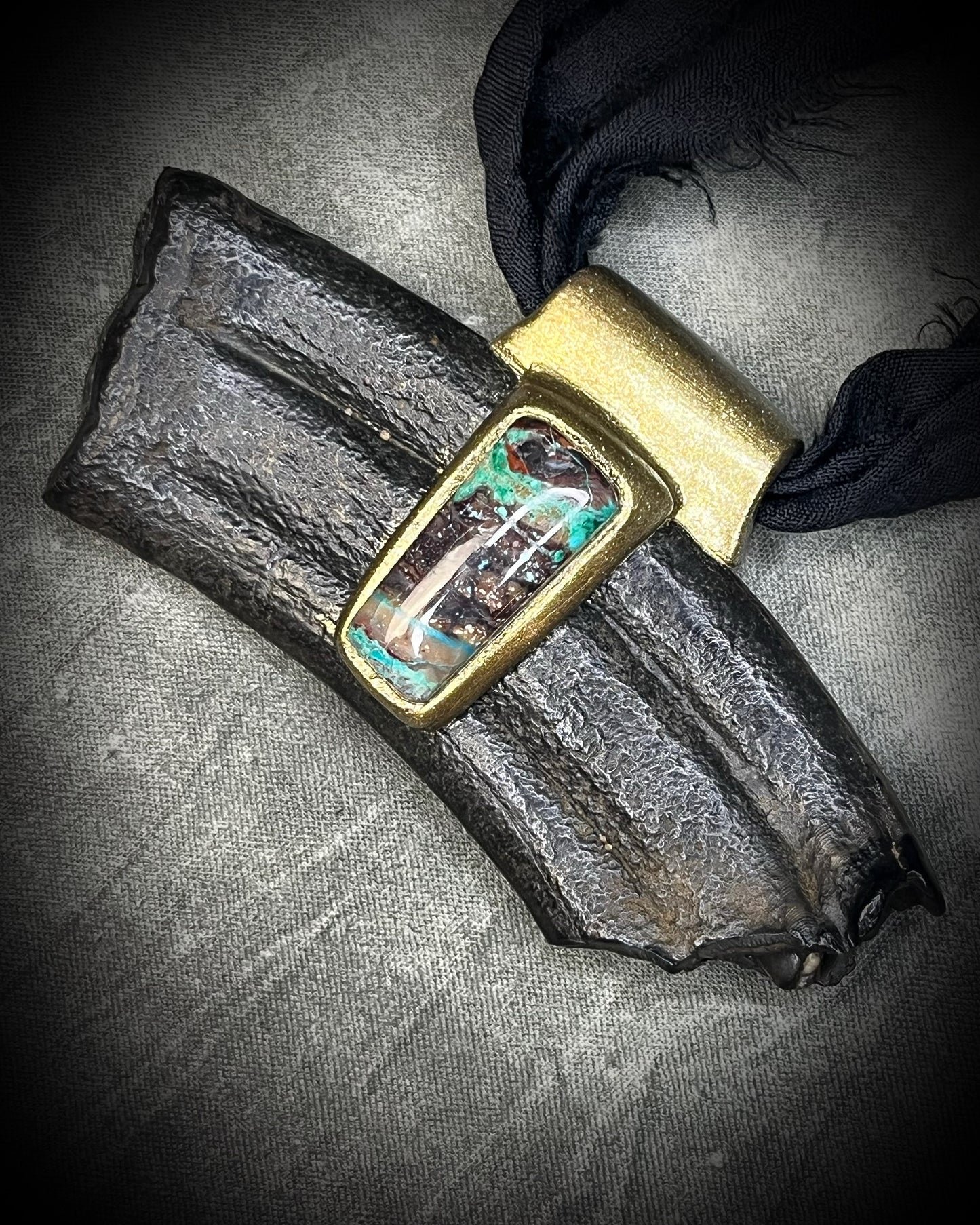 Equus fossil and chrysocolla talisman on black recycled silk, featuring ancient horse fossil material and blue-green chrysocolla, handmade by Become Spellbound in Baltimore, Maryland.