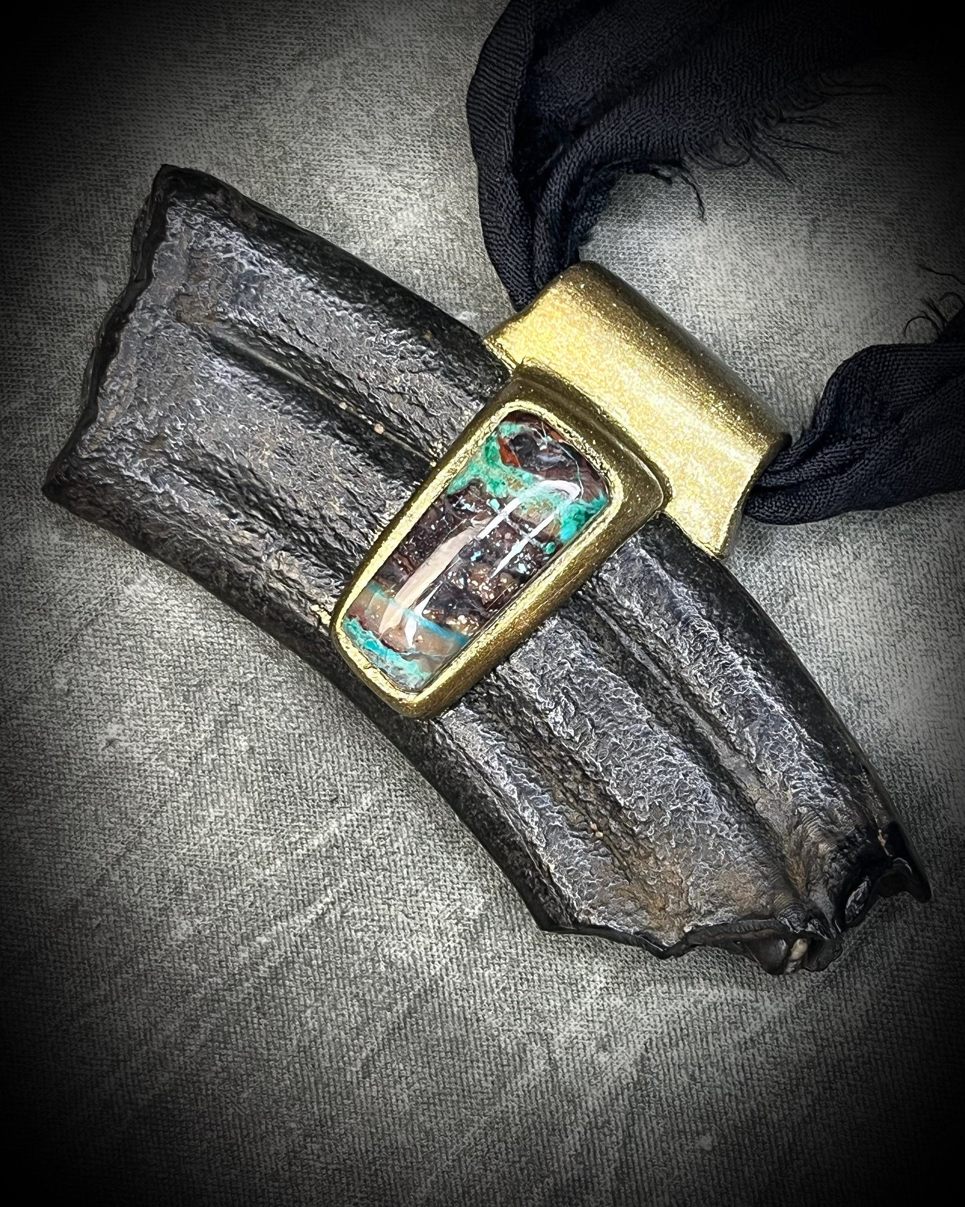 Equus fossil and chrysocolla talisman on black recycled silk, featuring ancient horse fossil material and blue-green chrysocolla, handmade by Become Spellbound in Baltimore, Maryland.
