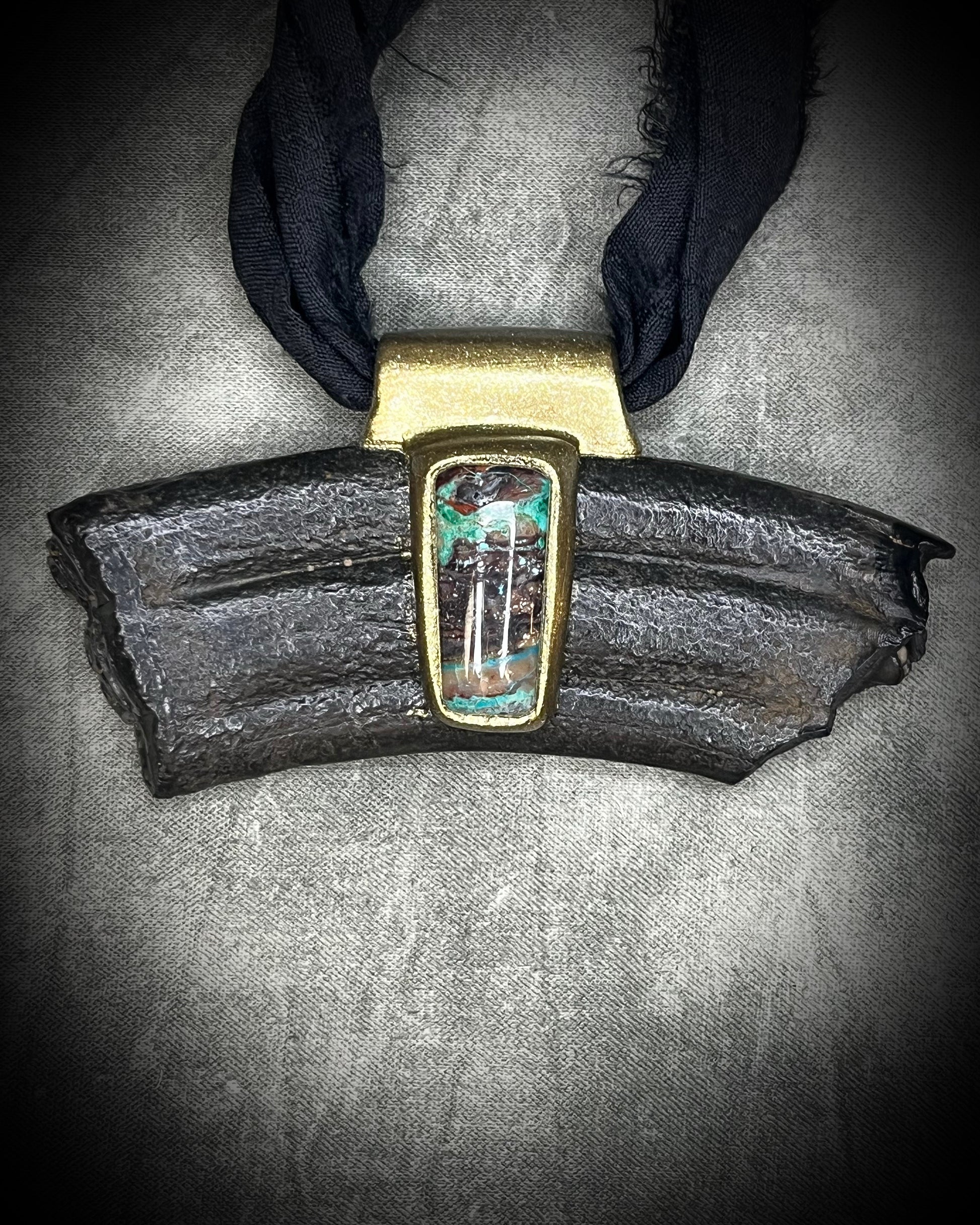 Equus fossil and hand-cut chrysocolla cabochon talisman on black recycled silk, handmade by Kari Dern of Become Spellbound in Baltimore, Maryland.