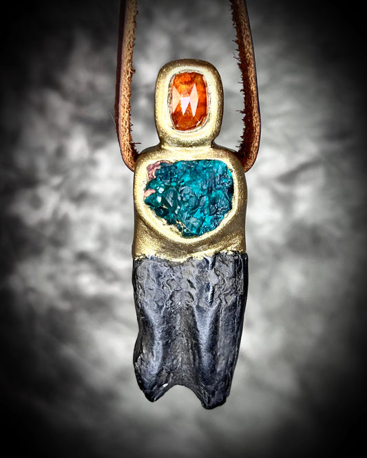 Close-up of gold-tone Equus horse tooth fossil pendant adorned with orange kyanite and green dioptase crystals — mystical handcrafted fossil and crystal necklace