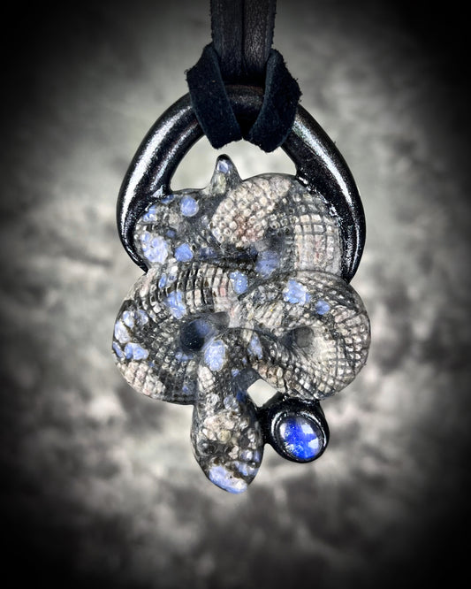 Que Sera crystal carved snake or serpent necklace for 2025 year of the snake.  Handmade pendant crafted with Moonstone and hung from black leather for a mystical goddess. 