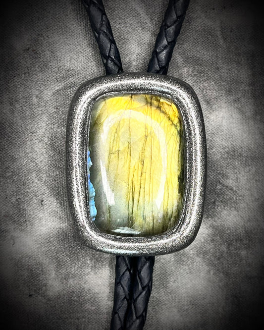 Labradorite Crystal bolo tie jewelry. Trending men’s accessories fall 2025. Statement bolo tie with gemstones. Alternative men’s fashion jewelry. Gender-fluid bolo tie styling. Western-inspired necklace with crystals. Unique leather bolo tie for him or her.
