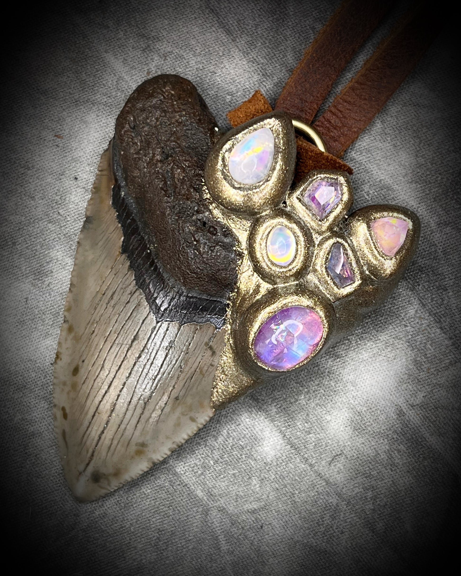 Fantasy inspired handmade Megalodon Fossil Shark Tooth Talisman necklaces with many gemstones including Moonstone, Spinel, Tourmaline and brown Leather for meditation, spiritual practice and everyday magic. 