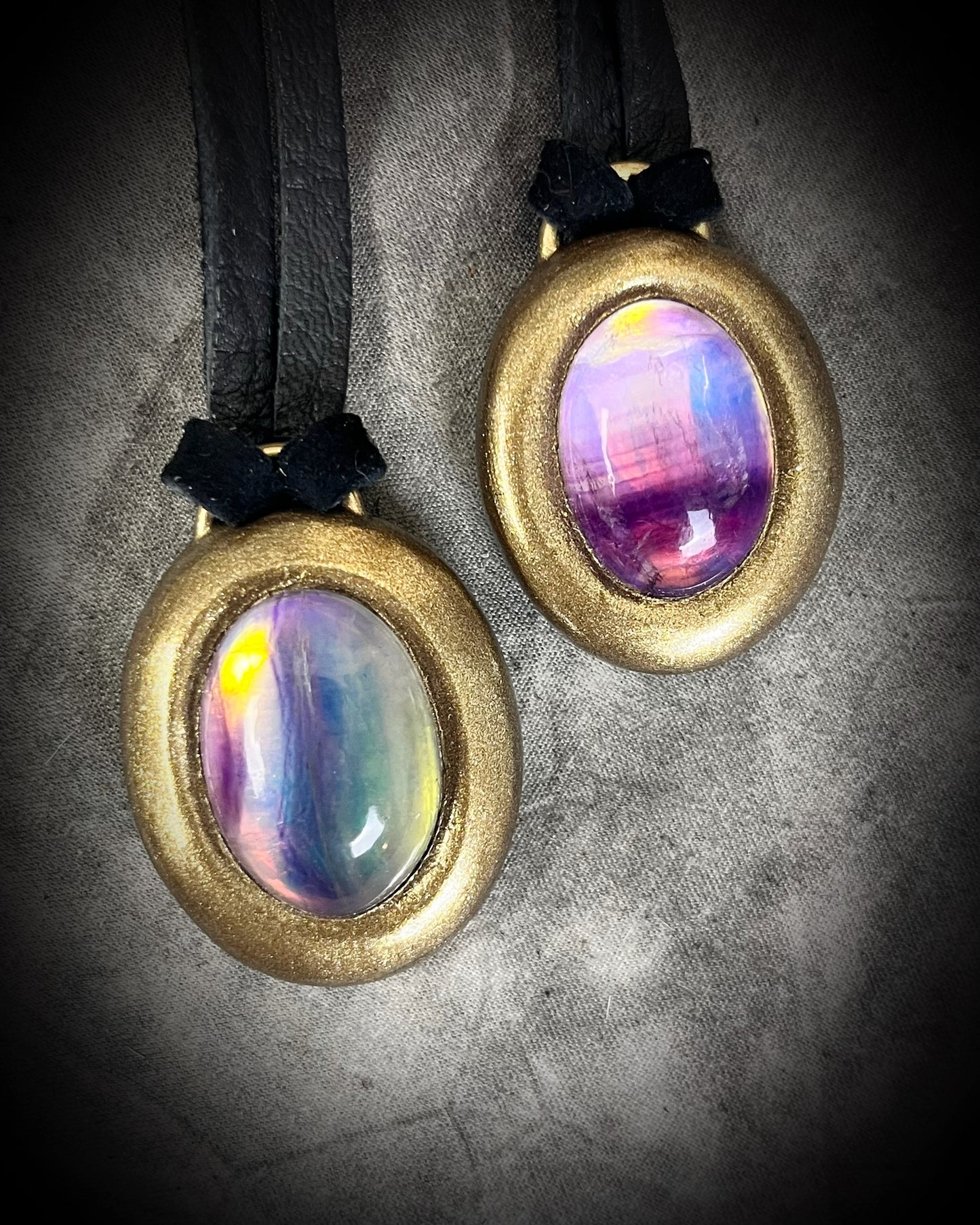 Fluorite cabochon oval necklaces in gold tone settings on black leather – mystical crystal jewelry for clarity, focus, and balance. Handmade gemstone pendant talismans, grounding and protective fluorite statement necklaces, perfect spiritual jewelry for daily wear, meditation, or gifting.