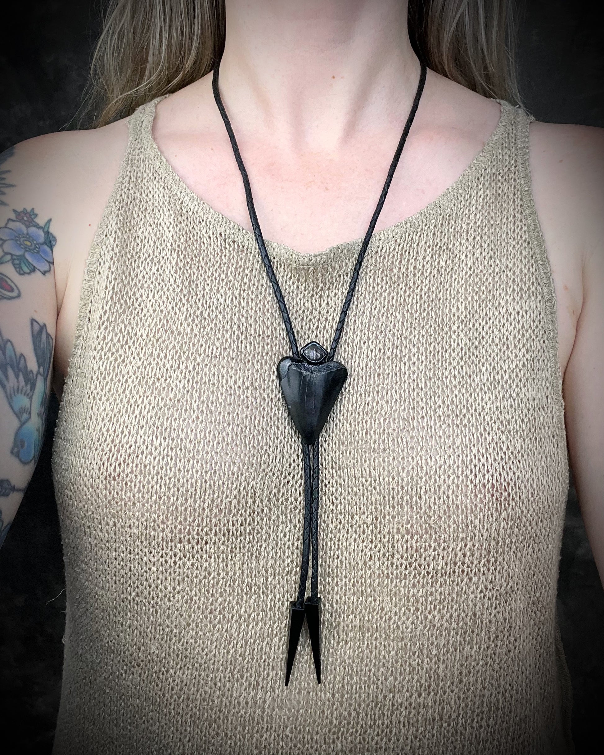 Fossil Great White shark tooth bolo tie with petroleum quartz crystal, black leather, and black spike tips, gothic statement fossil jewelry handmade in Baltimore Maryland