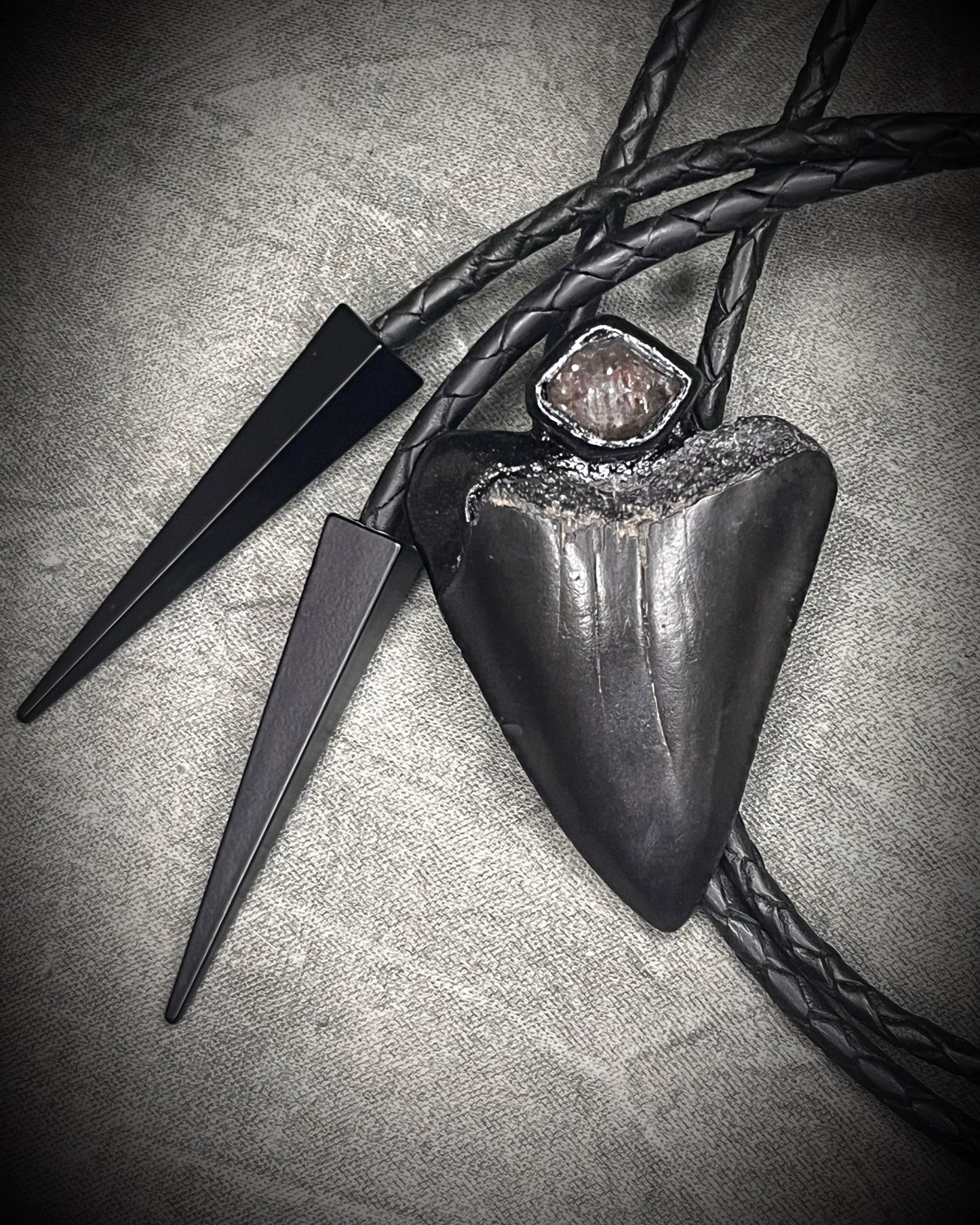 Fossil Great White shark tooth bolo tie with petroleum quartz crystal, black leather, and black spike tips, gothic statement fossil jewelry handmade in Baltimore Maryland