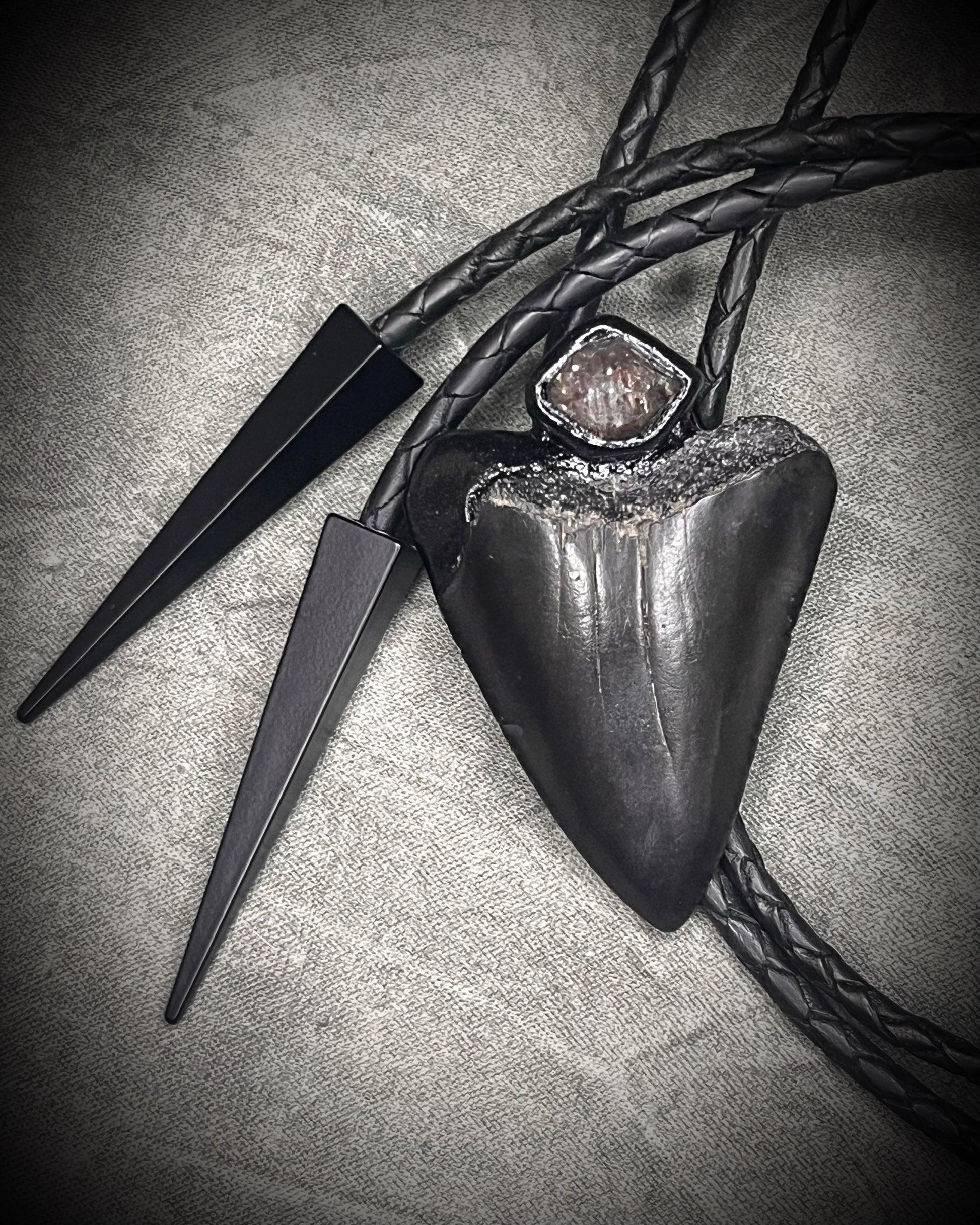 Fossil Great White shark tooth bolo tie with petroleum quartz crystal, black leather, and black spike tips, gothic statement fossil jewelry handmade in Baltimore Maryland