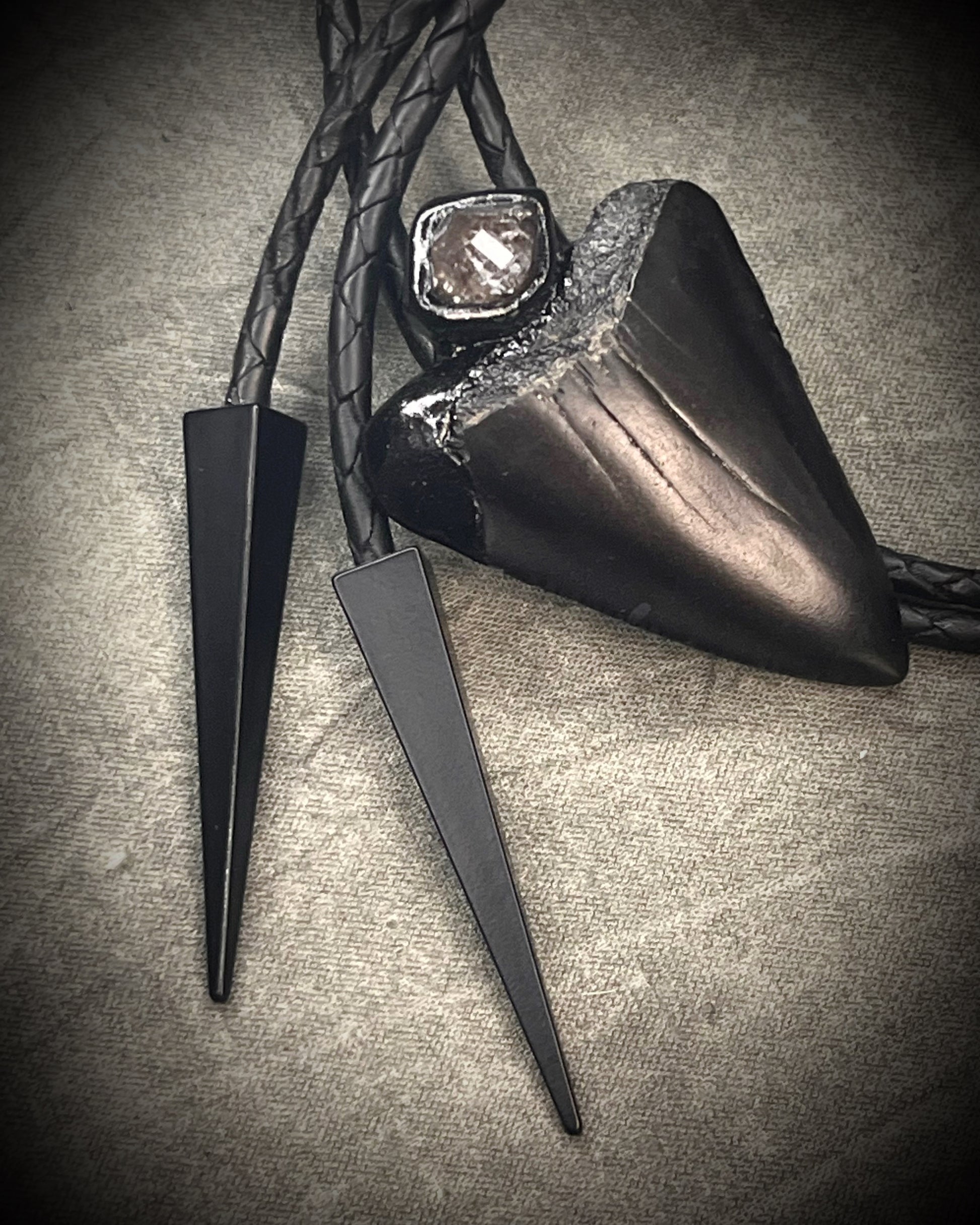 Fossil Great White shark tooth bolo tie with petroleum quartz crystal, black leather, and black spike tips, gothic statement fossil jewelry handmade in Baltimore Maryland 