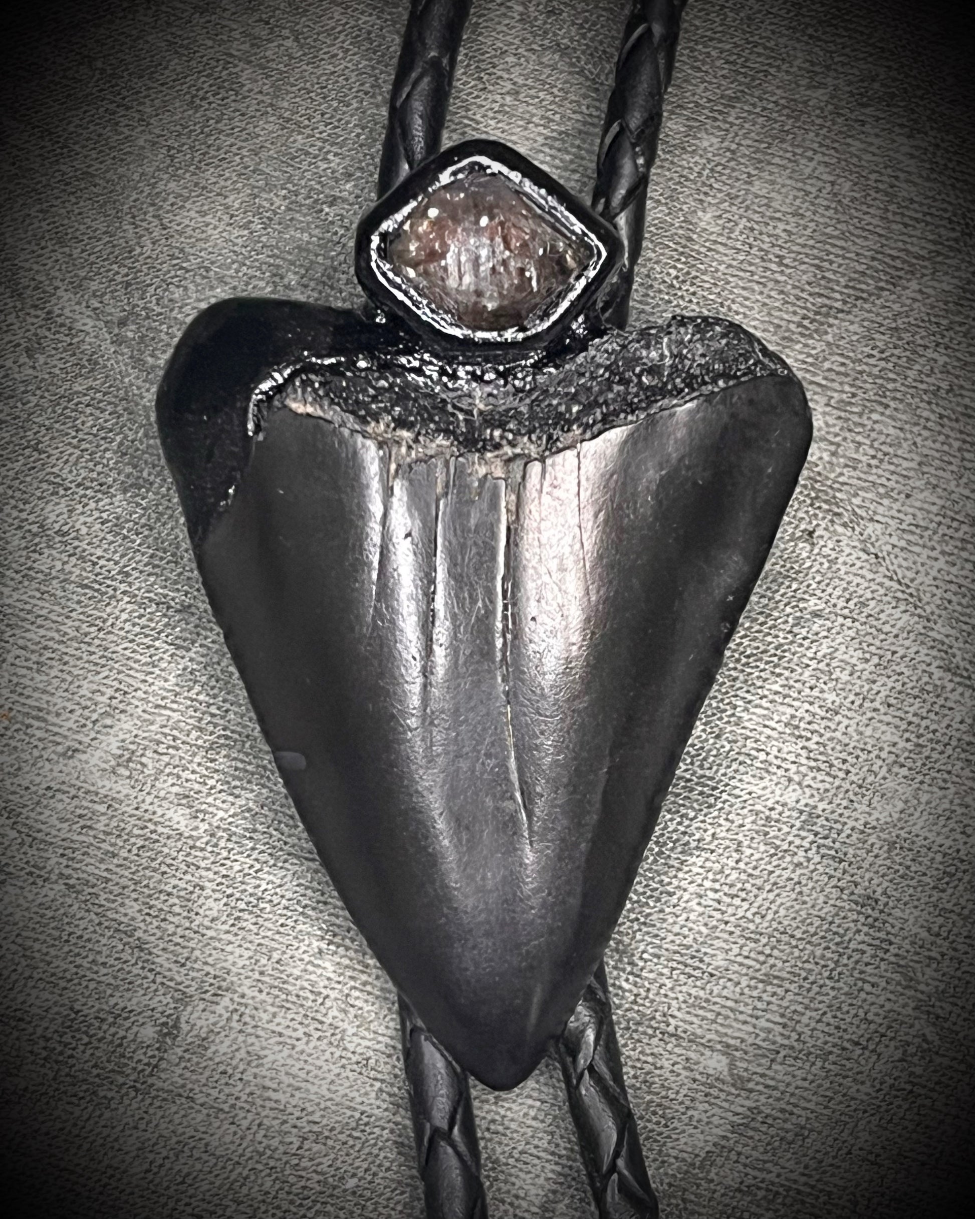Fossil Great White shark tooth bolo tie with petroleum quartz crystal, black leather, and black spike tips, gothic statement fossil jewelry handmade in Baltimore Maryland 