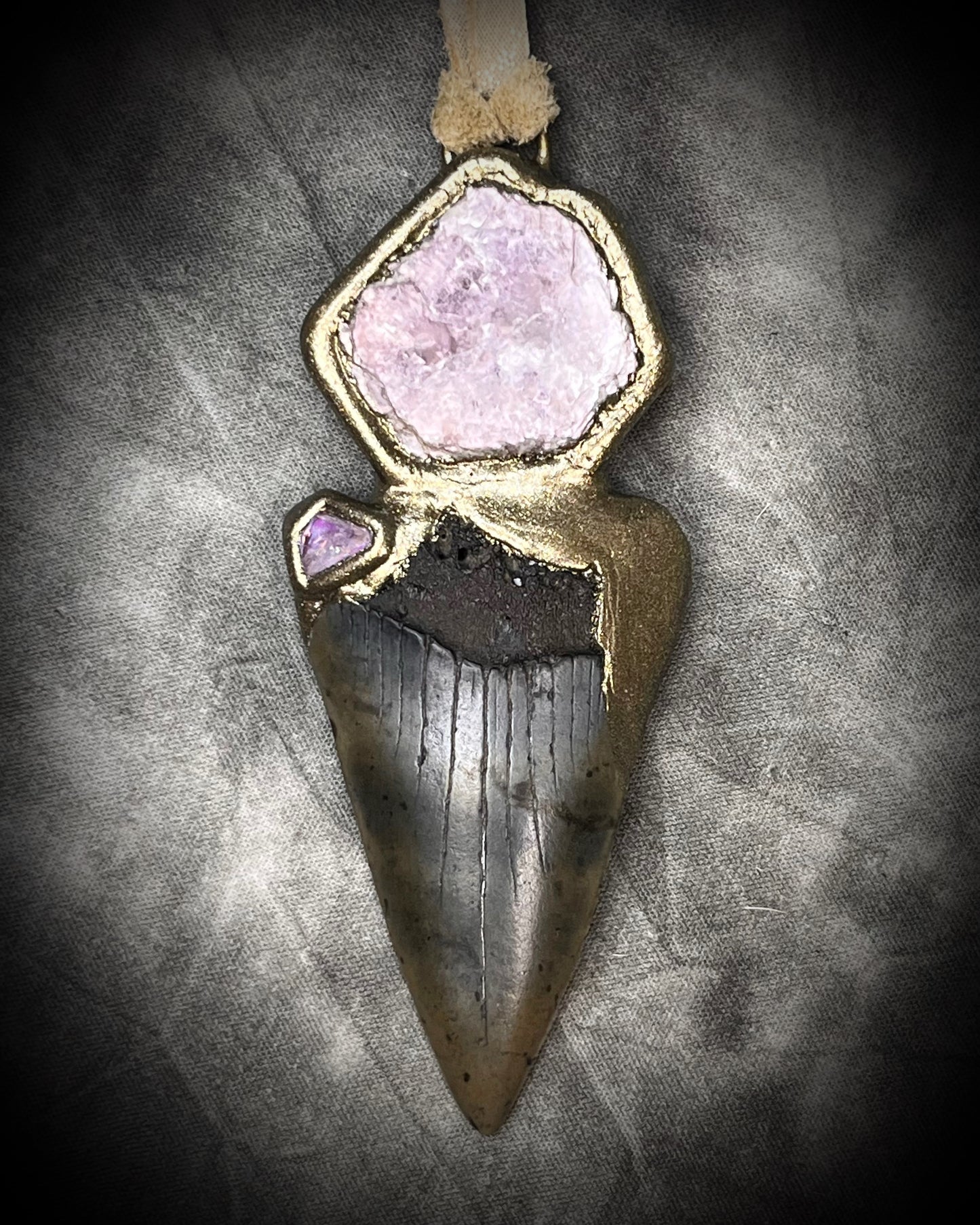 Fossil Mako Shark Tooth necklace hung from soft gold leather and adorned with soothing Lepidolite crystal and lavender spinel gemstone. Spiritual boho jewelry gift for her. 