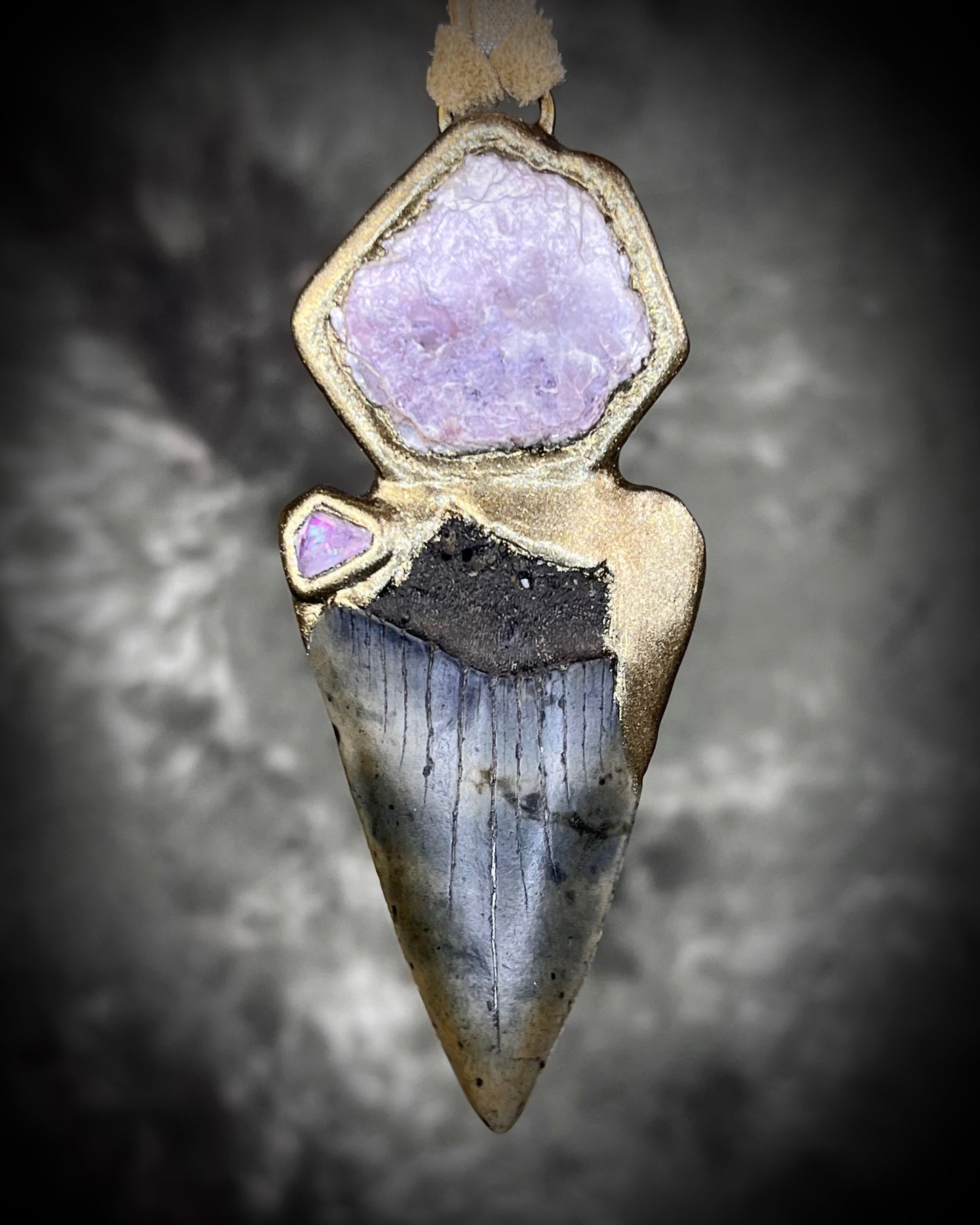 Fossil Mako Shark Tooth necklace hung from soft gold leather and adorned with soothing Lepidolite crystal and lavender spinel gemstone. Spiritual boho jewelry gift for her. 