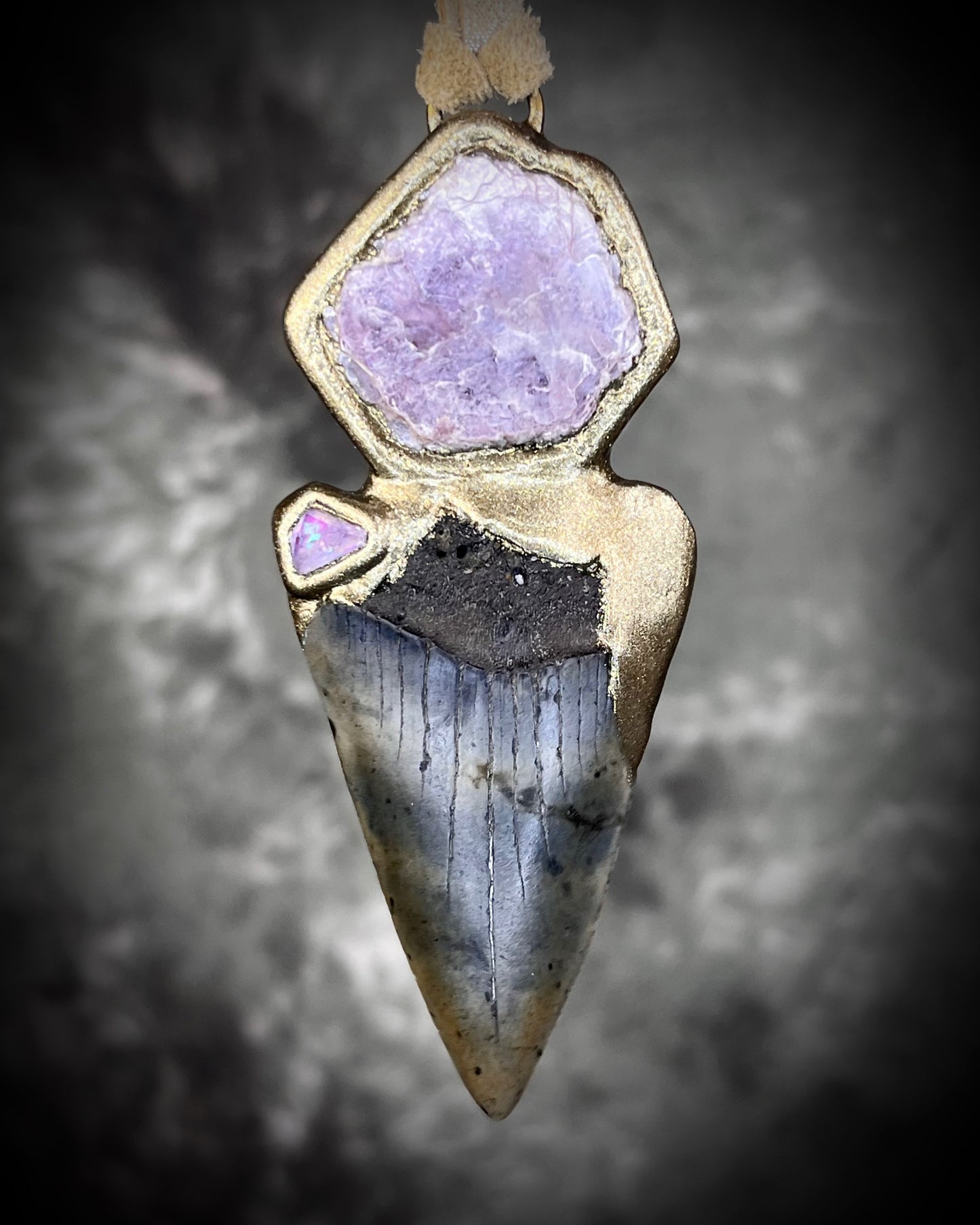 Fossil Mako Shark Tooth necklace hung from soft gold leather and adorned with soothing Lepidolite crystal and lavender spinel gemstone. Spiritual boho jewelry gift for her.  