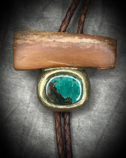 Fossilized mammoth tusk and chrysocolla bolo tie on brown leather with gold finish and gold spike tips, handmade by Become Spellbound.
