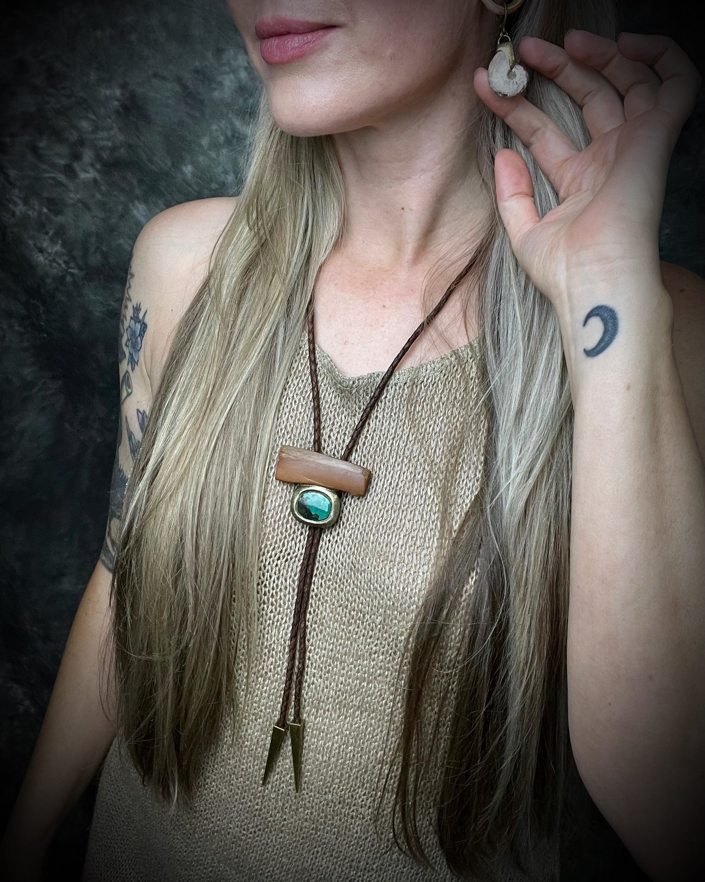 Fossilized mammoth tusk and chrysocolla bolo tie on brown leather with gold finish and gold spike tips, handmade by Become Spellbound.